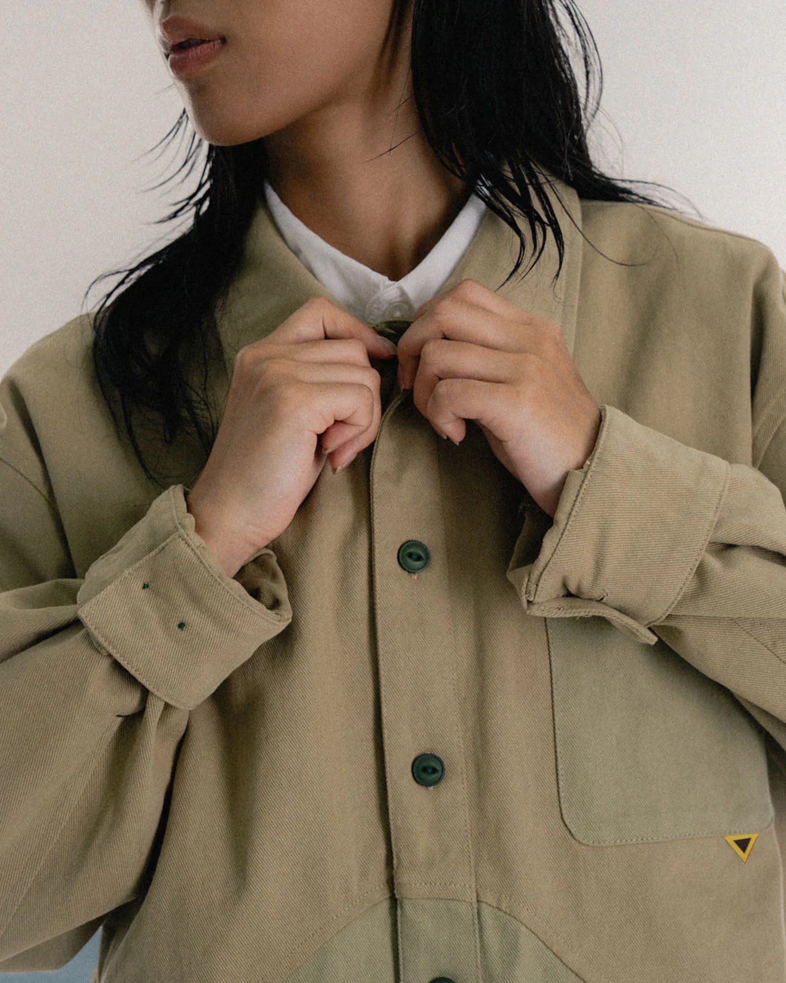 A Eckhaus Latta Shirt pictured on a model in front of a white background. The title of the product is Eckhaus Latta Eclipse Turtleneck - Stone and the image was taken by 199A®.