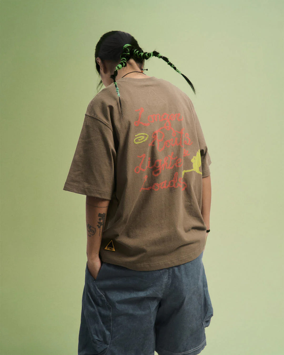 A Eckhaus Latta Shirt pictured on a model in front of a white background. The title of the product is Eckhaus Latta Eclipse Turtleneck - Stone and the image was taken by 199A®.