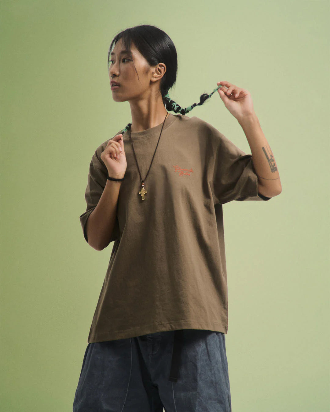 A Eckhaus Latta Shirt pictured on a model in front of a white background. The title of the product is Eckhaus Latta Eclipse Turtleneck - Stone and the image was taken by 199A®.
