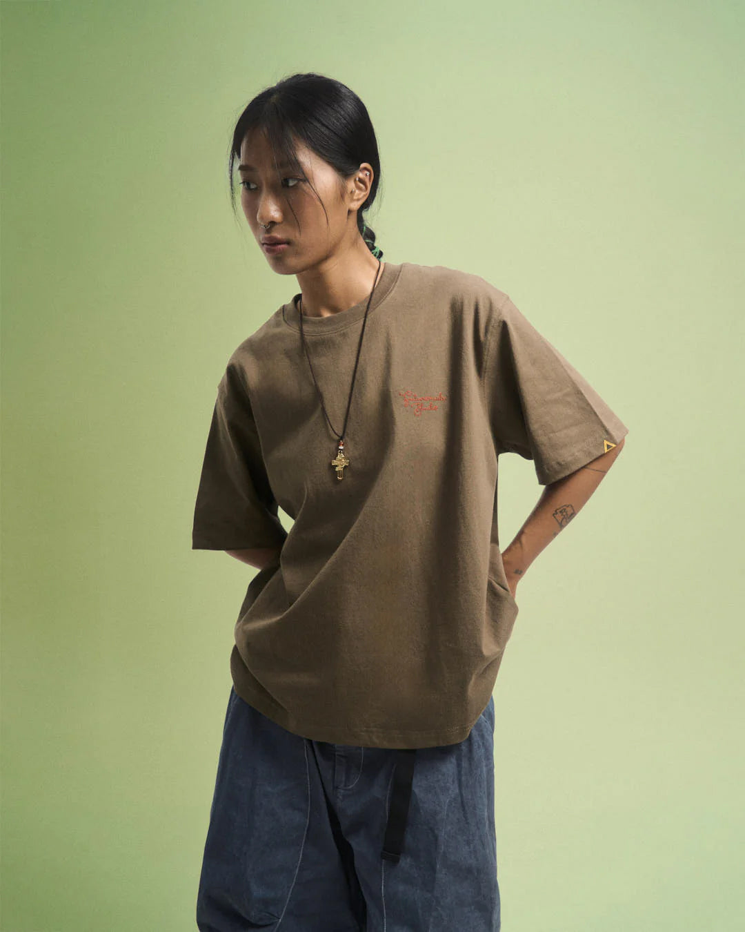 A Eckhaus Latta Shirt pictured on a model in front of a white background. The title of the product is Eckhaus Latta Eclipse Turtleneck - Stone and the image was taken by 199A®.