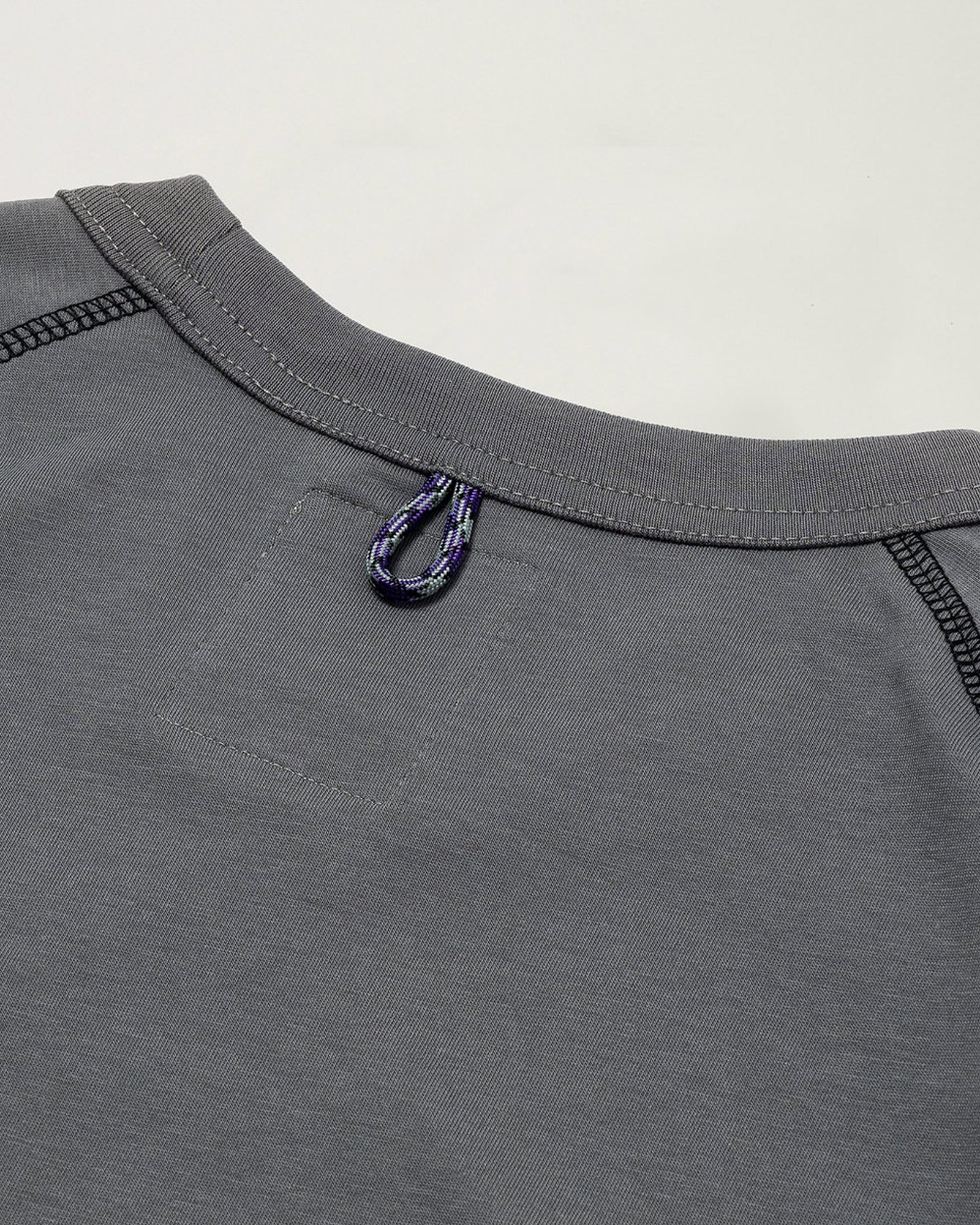 A Eckhaus Latta Shirt pictured on a model in front of a white background. The title of the product is Eckhaus Latta Eclipse Turtleneck - Stone and the image was taken by 199A®.