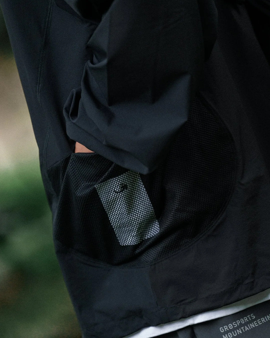 A Eckhaus Latta Shirt pictured on a model in front of a white background. The title of the product is Eckhaus Latta Eclipse Turtleneck - Stone and the image was taken by 199A®.