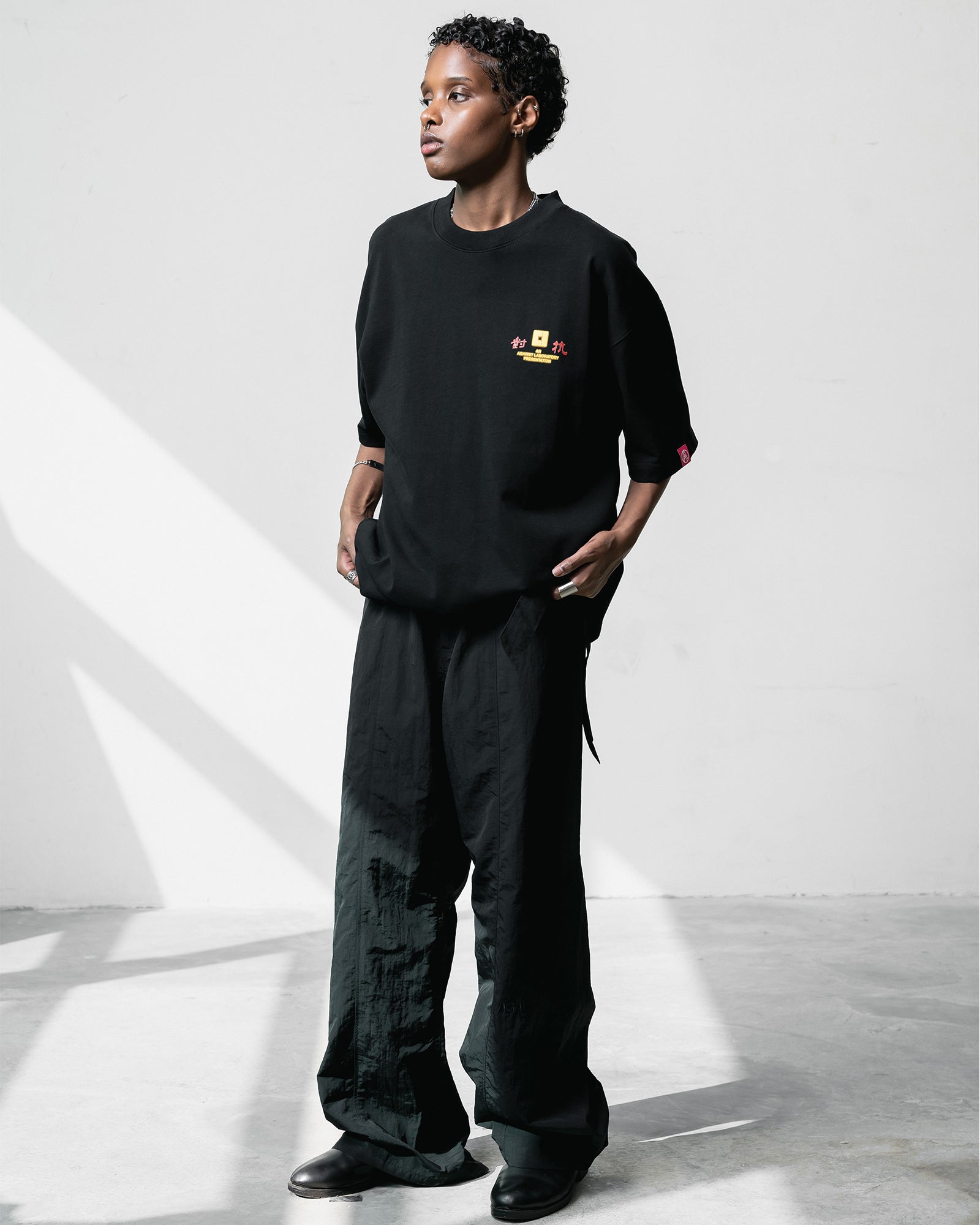 A Eckhaus Latta Shirt pictured on a model in front of a white background. The title of the product is Eckhaus Latta Eclipse Turtleneck - Stone and the image was taken by 199A®.