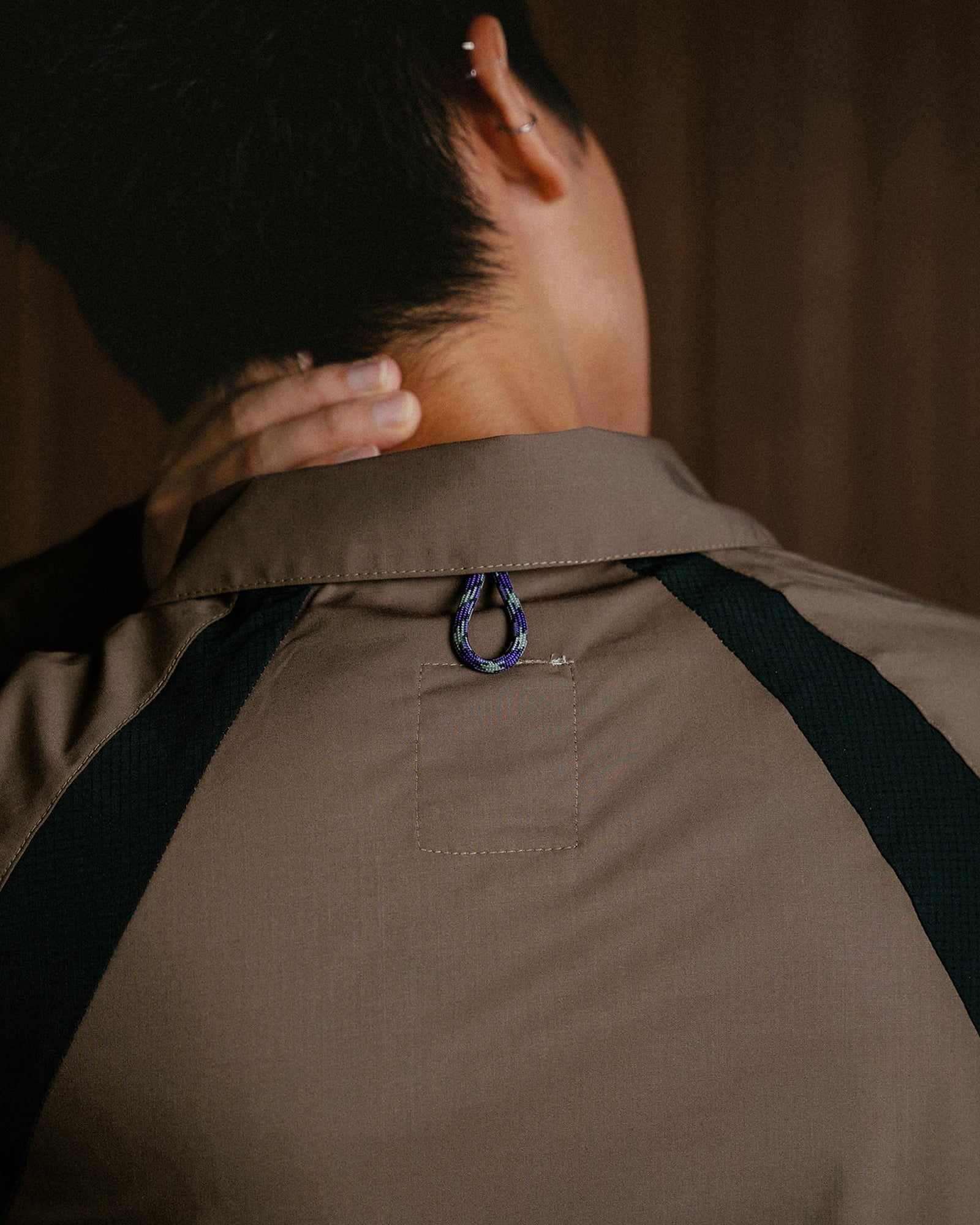 A Eckhaus Latta Shirt pictured on a model in front of a white background. The title of the product is Eckhaus Latta Eclipse Turtleneck - Stone and the image was taken by 199A®.