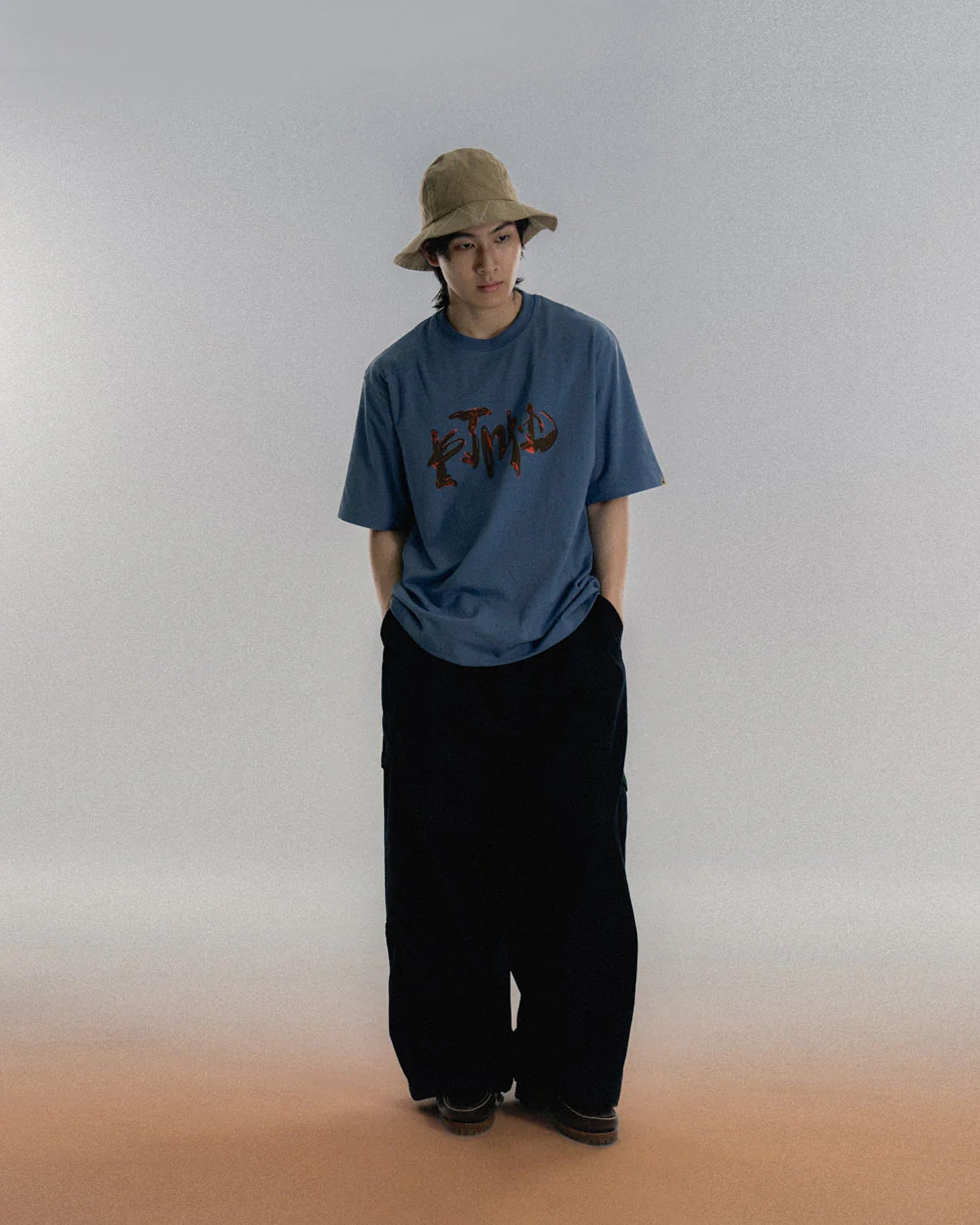 A Eckhaus Latta Shirt pictured on a model in front of a white background. The title of the product is Eckhaus Latta Eclipse Turtleneck - Stone and the image was taken by 199A®.