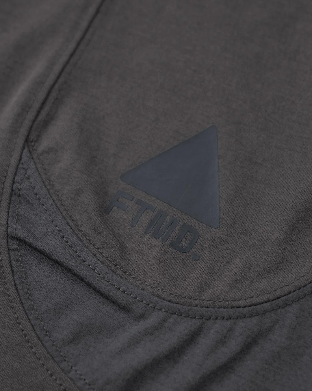 A Eckhaus Latta Shirt pictured on a model in front of a white background. The title of the product is Eckhaus Latta Eclipse Turtleneck - Stone and the image was taken by 199A®.