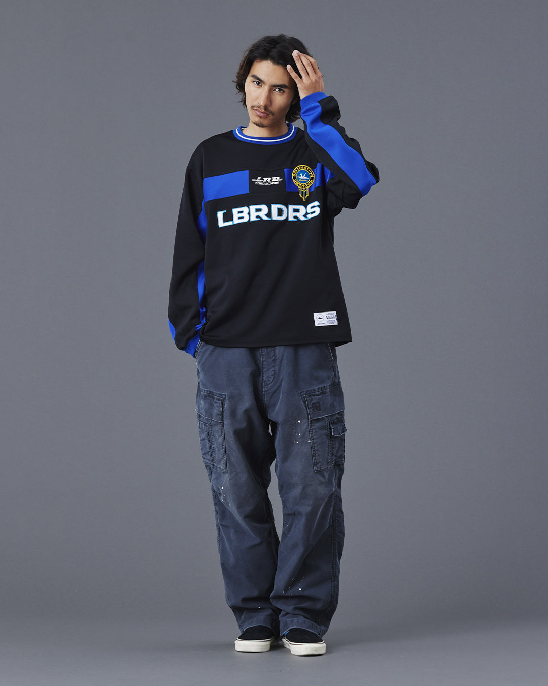 A Eckhaus Latta Shirt pictured on a model in front of a white background. The title of the product is Eckhaus Latta Eclipse Turtleneck - Stone and the image was taken by 199A®.