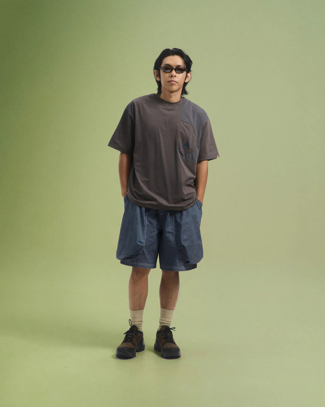 A Eckhaus Latta Shirt pictured on a model in front of a white background. The title of the product is Eckhaus Latta Eclipse Turtleneck - Stone and the image was taken by 199A®.