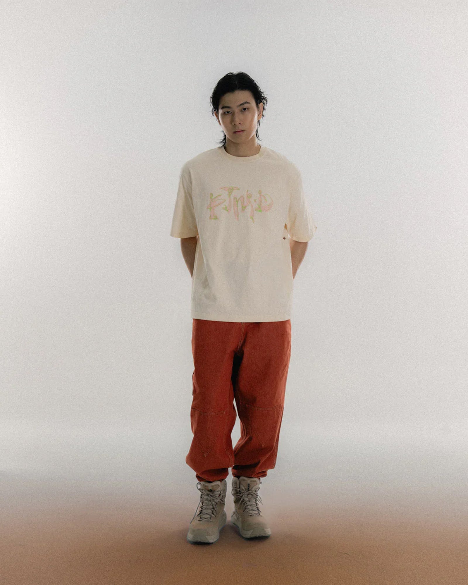 A Eckhaus Latta Shirt pictured on a model in front of a white background. The title of the product is Eckhaus Latta Eclipse Turtleneck - Stone and the image was taken by 199A®.