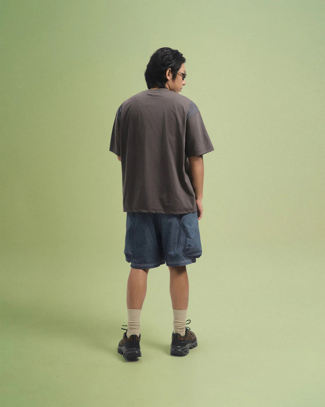 A Eckhaus Latta Shirt pictured on a model in front of a white background. The title of the product is Eckhaus Latta Eclipse Turtleneck - Stone and the image was taken by 199A®.