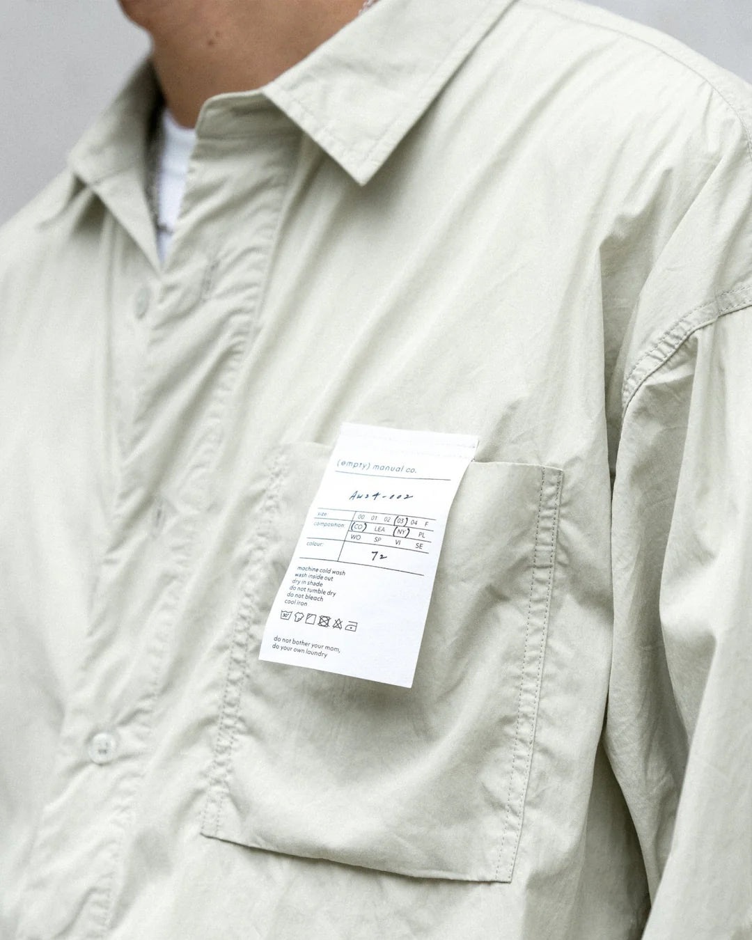 A Eckhaus Latta Shirt pictured on a model in front of a white background. The title of the product is Eckhaus Latta Eclipse Turtleneck - Stone and the image was taken by 199A®.