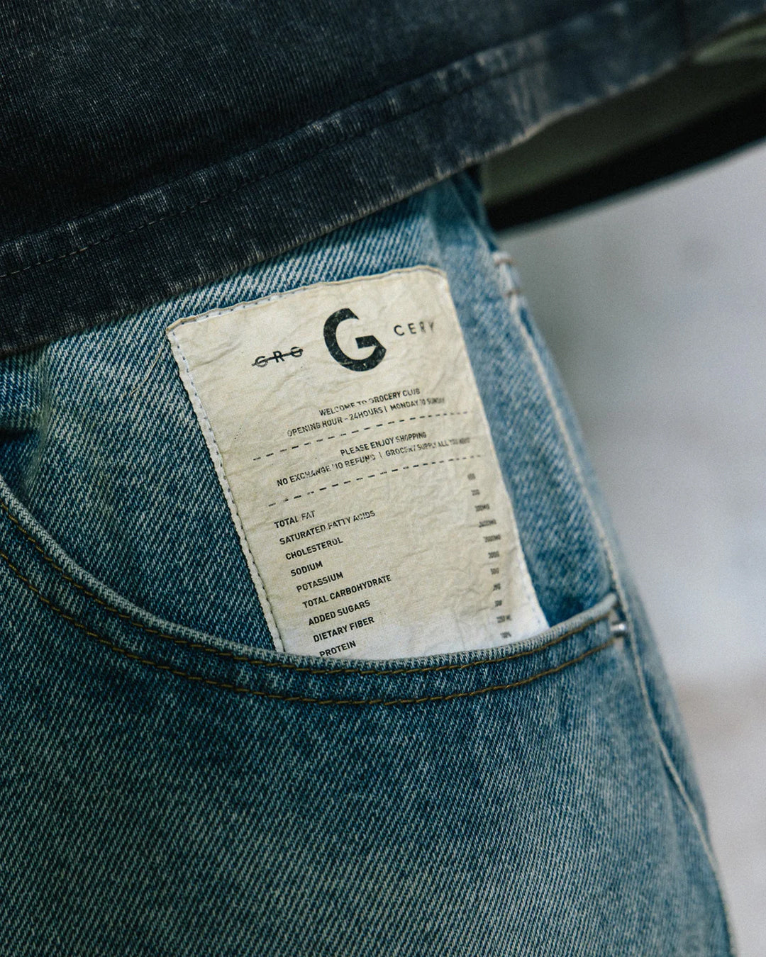 A Eckhaus Latta Shirt pictured on a model in front of a white background. The title of the product is Eckhaus Latta Eclipse Turtleneck - Stone and the image was taken by 199A®.