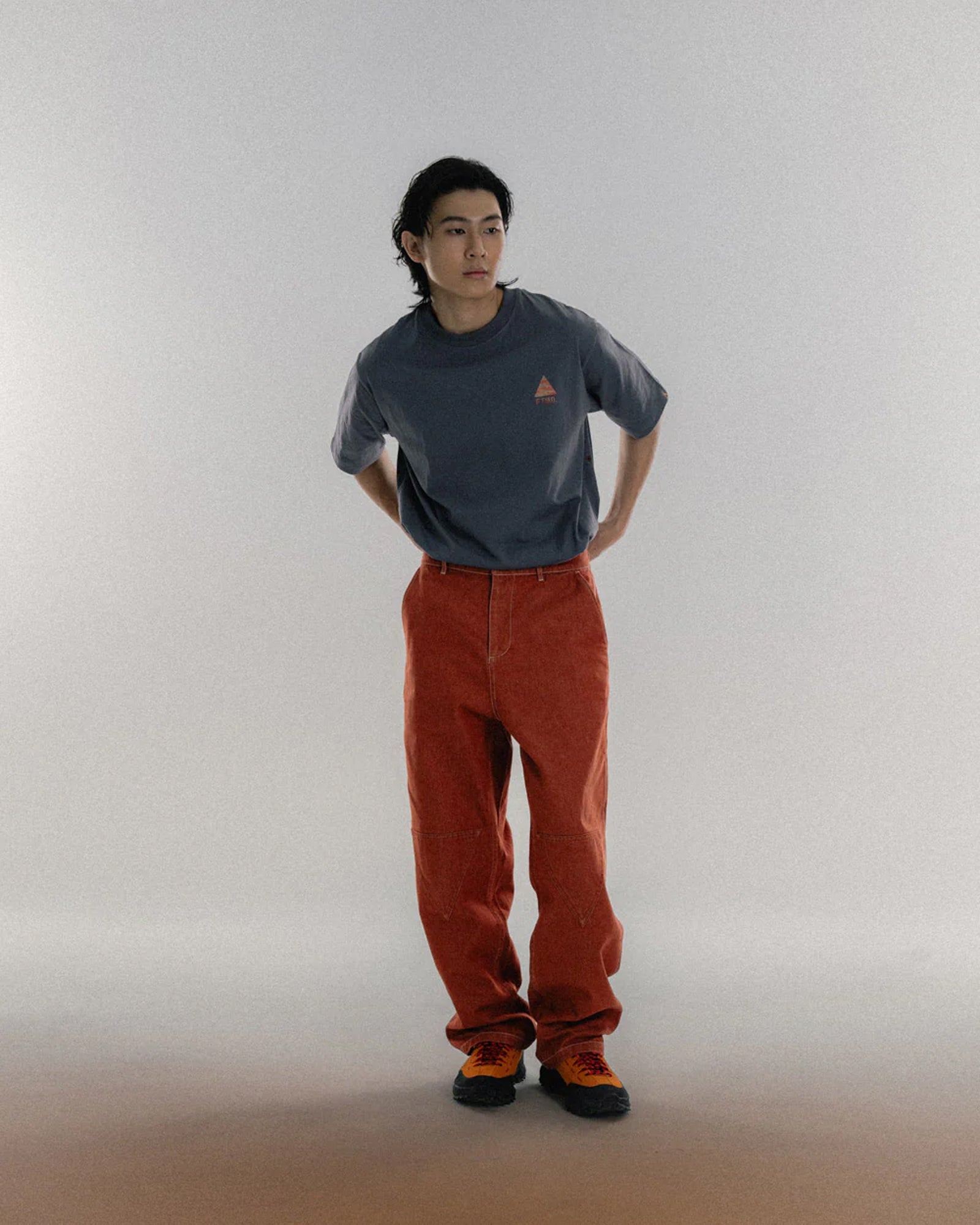 A Eckhaus Latta Shirt pictured on a model in front of a white background. The title of the product is Eckhaus Latta Eclipse Turtleneck - Stone and the image was taken by 199A®.