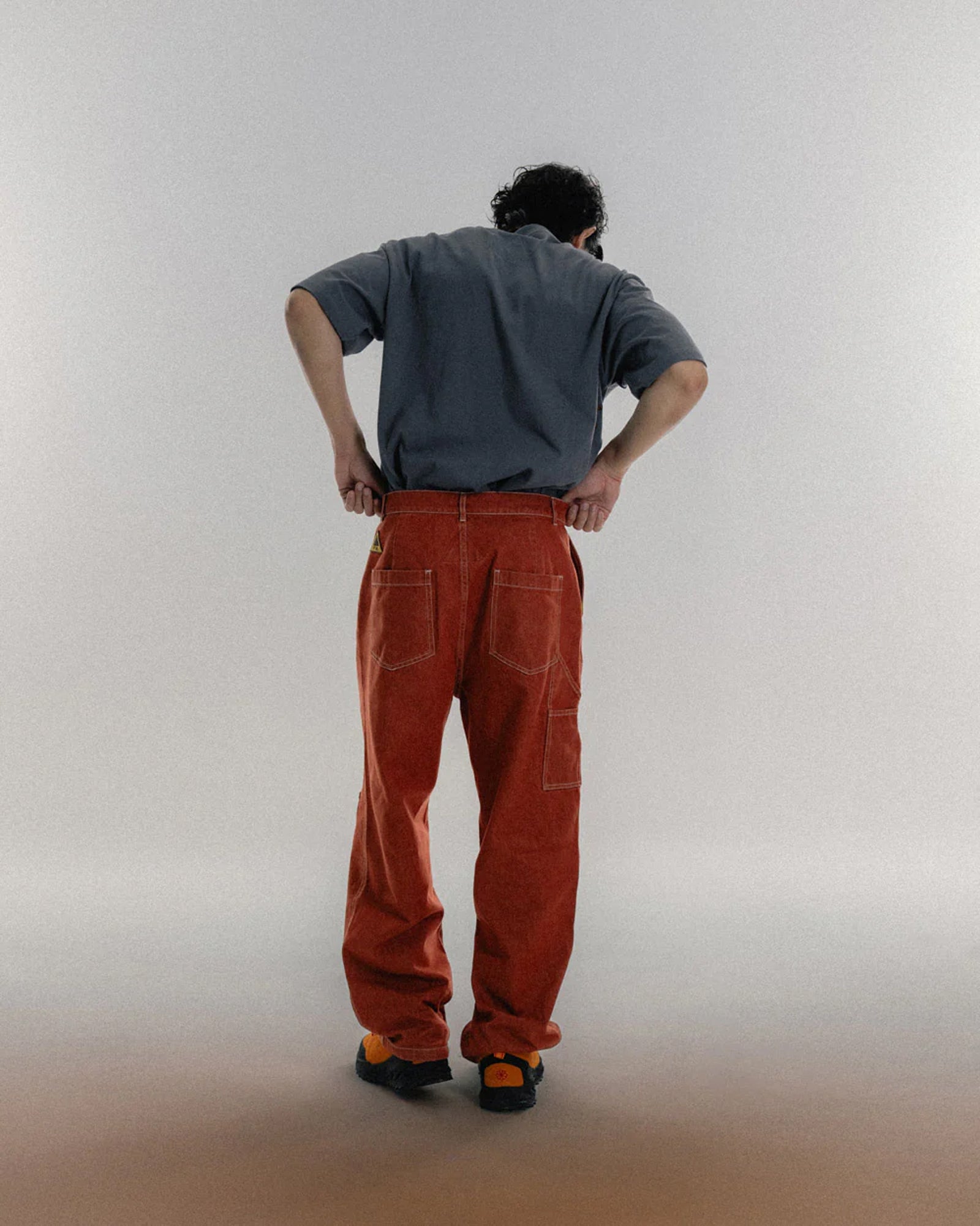 A Eckhaus Latta Shirt pictured on a model in front of a white background. The title of the product is Eckhaus Latta Eclipse Turtleneck - Stone and the image was taken by 199A®.