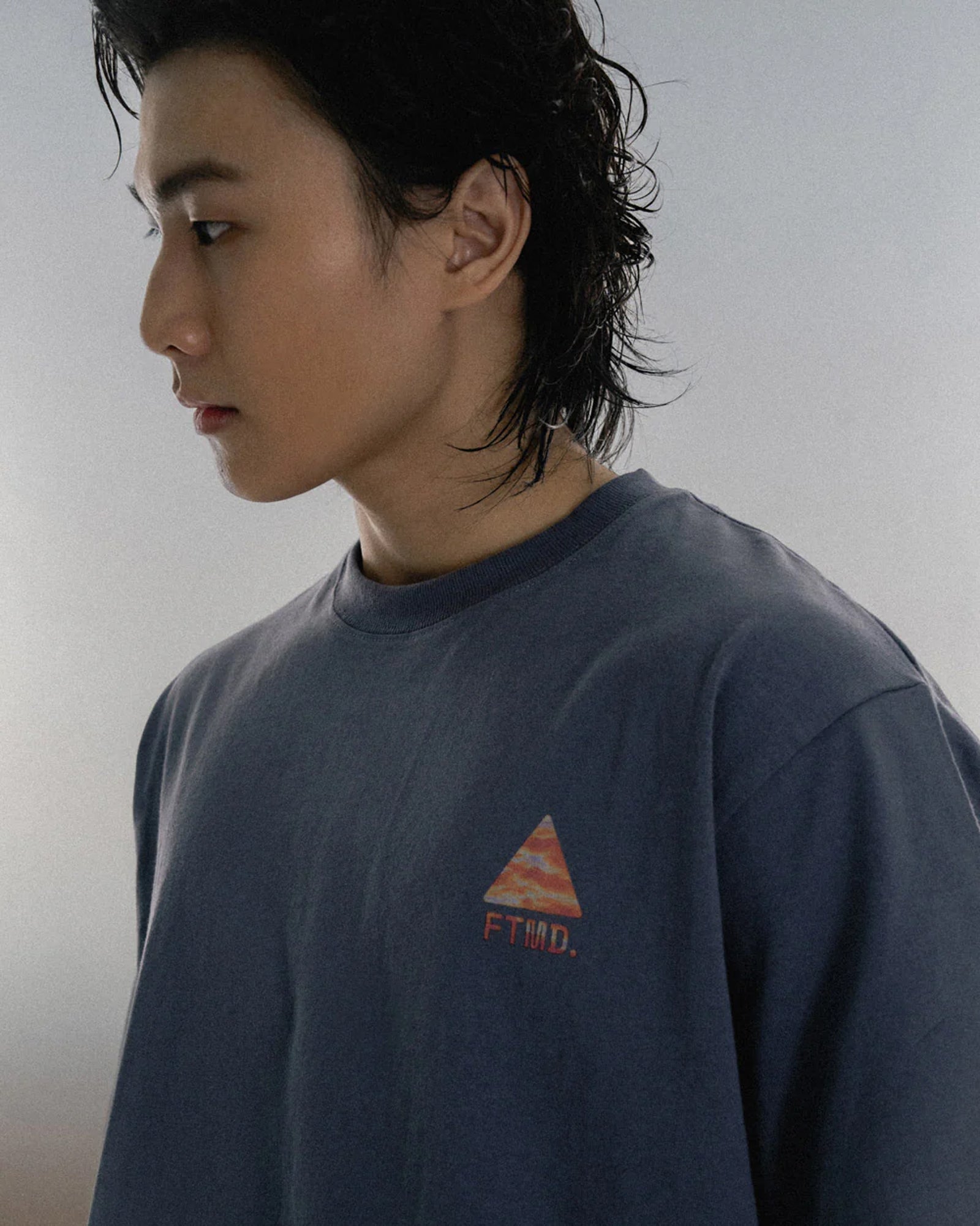 A Eckhaus Latta Shirt pictured on a model in front of a white background. The title of the product is Eckhaus Latta Eclipse Turtleneck - Stone and the image was taken by 199A®.