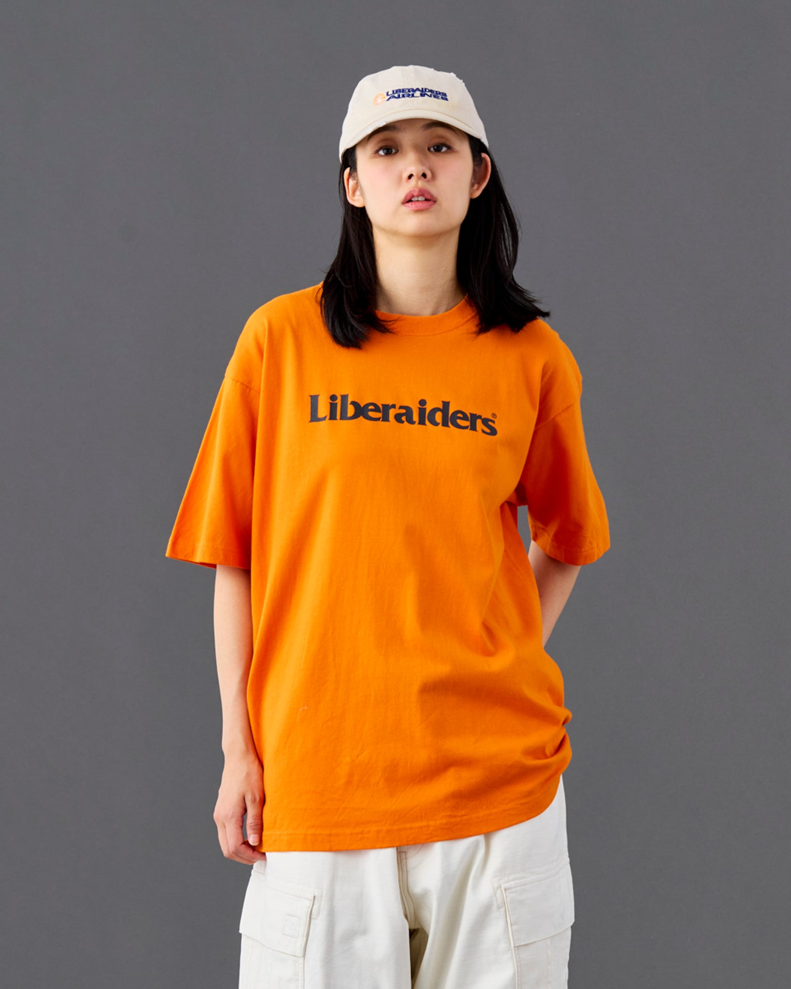 A Eckhaus Latta Shirt pictured on a model in front of a white background. The title of the product is Eckhaus Latta Eclipse Turtleneck - Stone and the image was taken by 199A®.