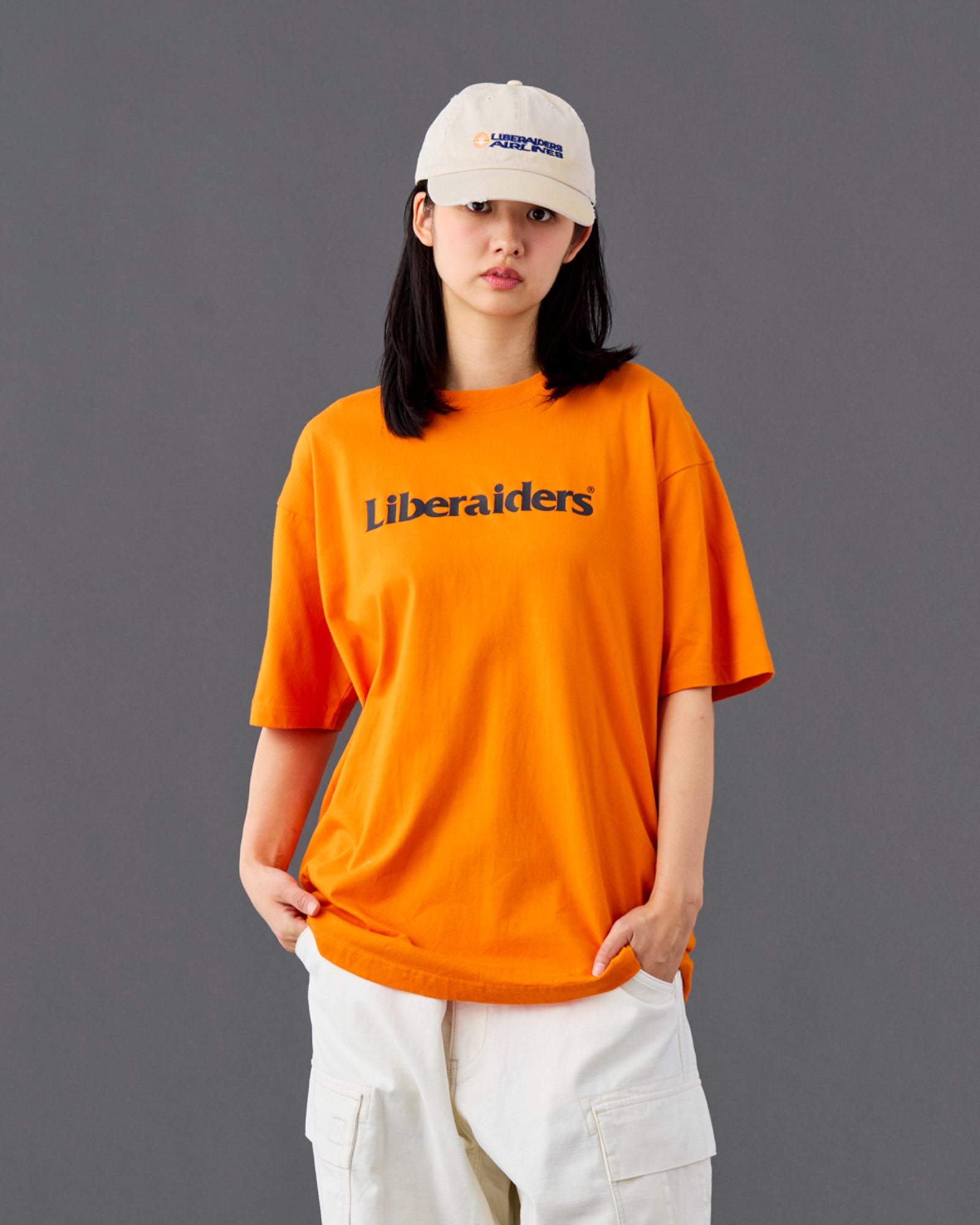 A Eckhaus Latta Shirt pictured on a model in front of a white background. The title of the product is Eckhaus Latta Eclipse Turtleneck - Stone and the image was taken by 199A®.