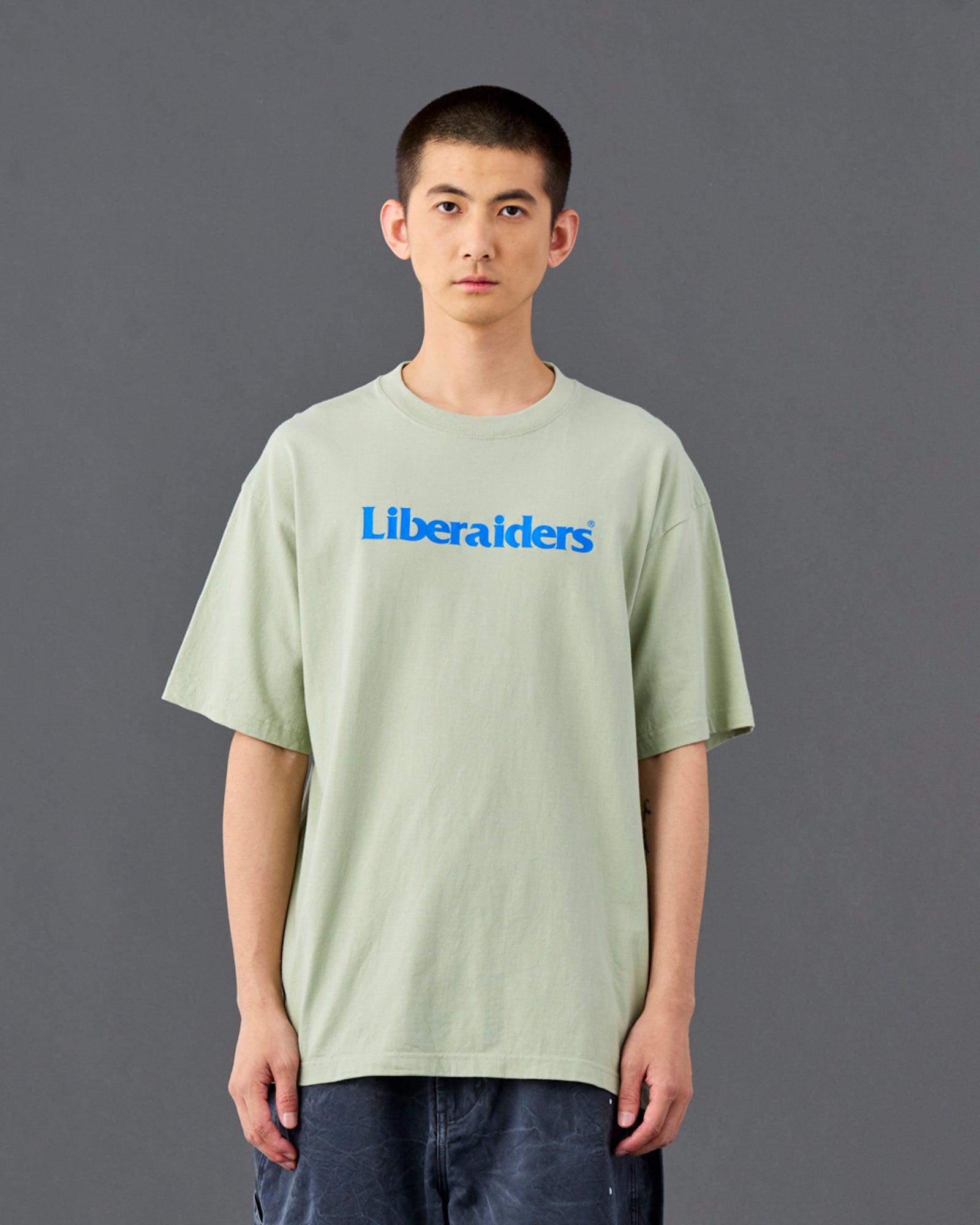 A Eckhaus Latta Shirt pictured on a model in front of a white background. The title of the product is Eckhaus Latta Eclipse Turtleneck - Stone and the image was taken by 199A®.