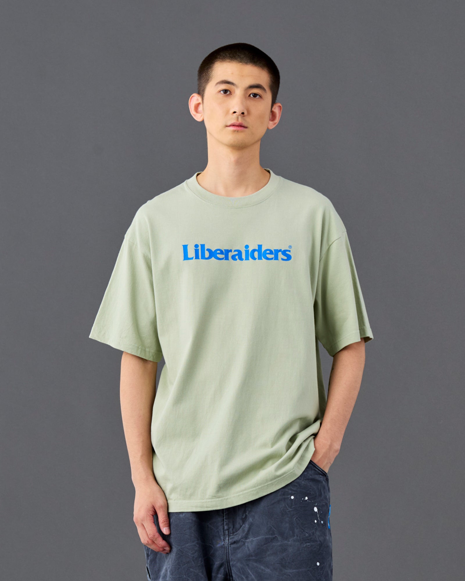 A Eckhaus Latta Shirt pictured on a model in front of a white background. The title of the product is Eckhaus Latta Eclipse Turtleneck - Stone and the image was taken by 199A®.