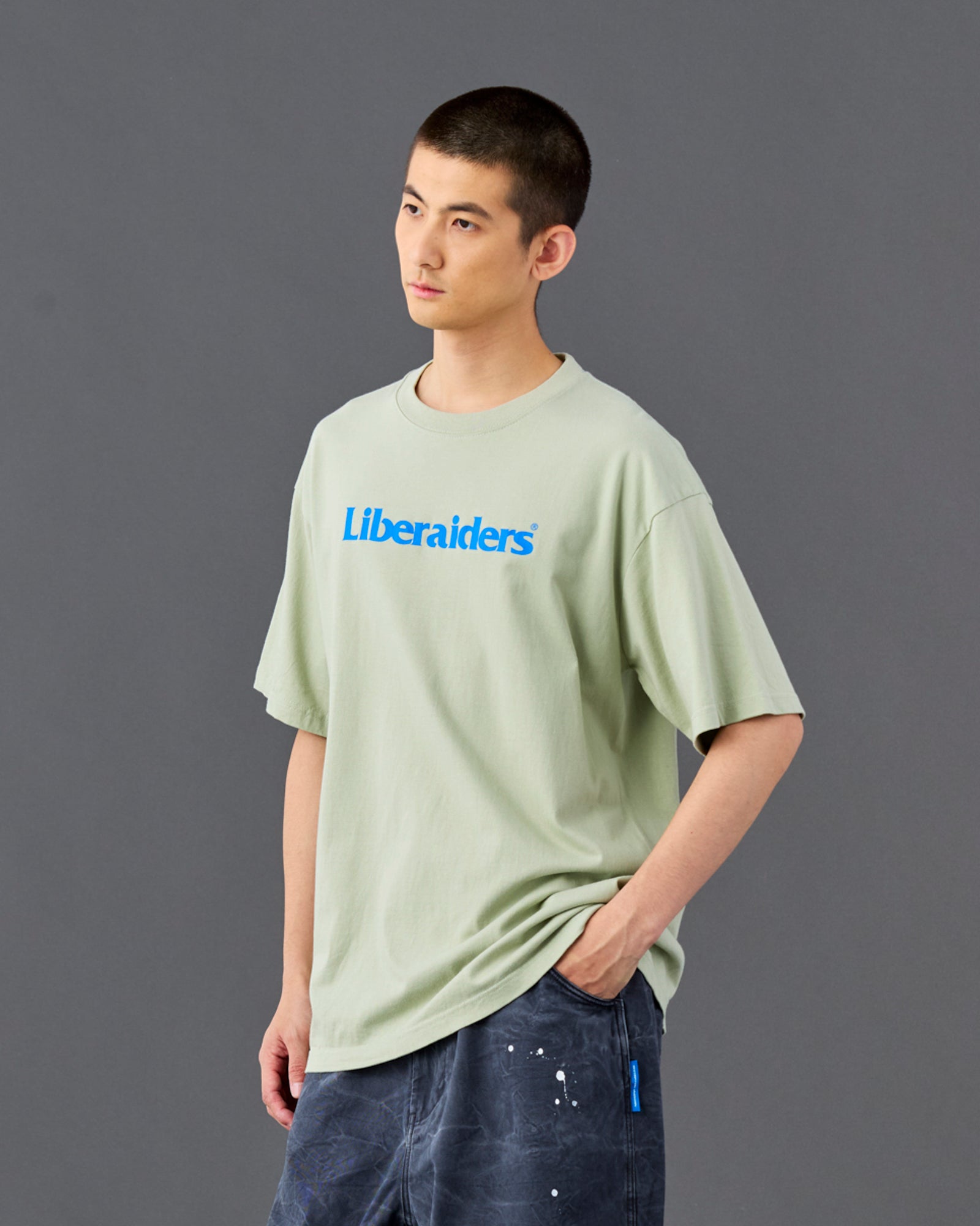A Eckhaus Latta Shirt pictured on a model in front of a white background. The title of the product is Eckhaus Latta Eclipse Turtleneck - Stone and the image was taken by 199A®.