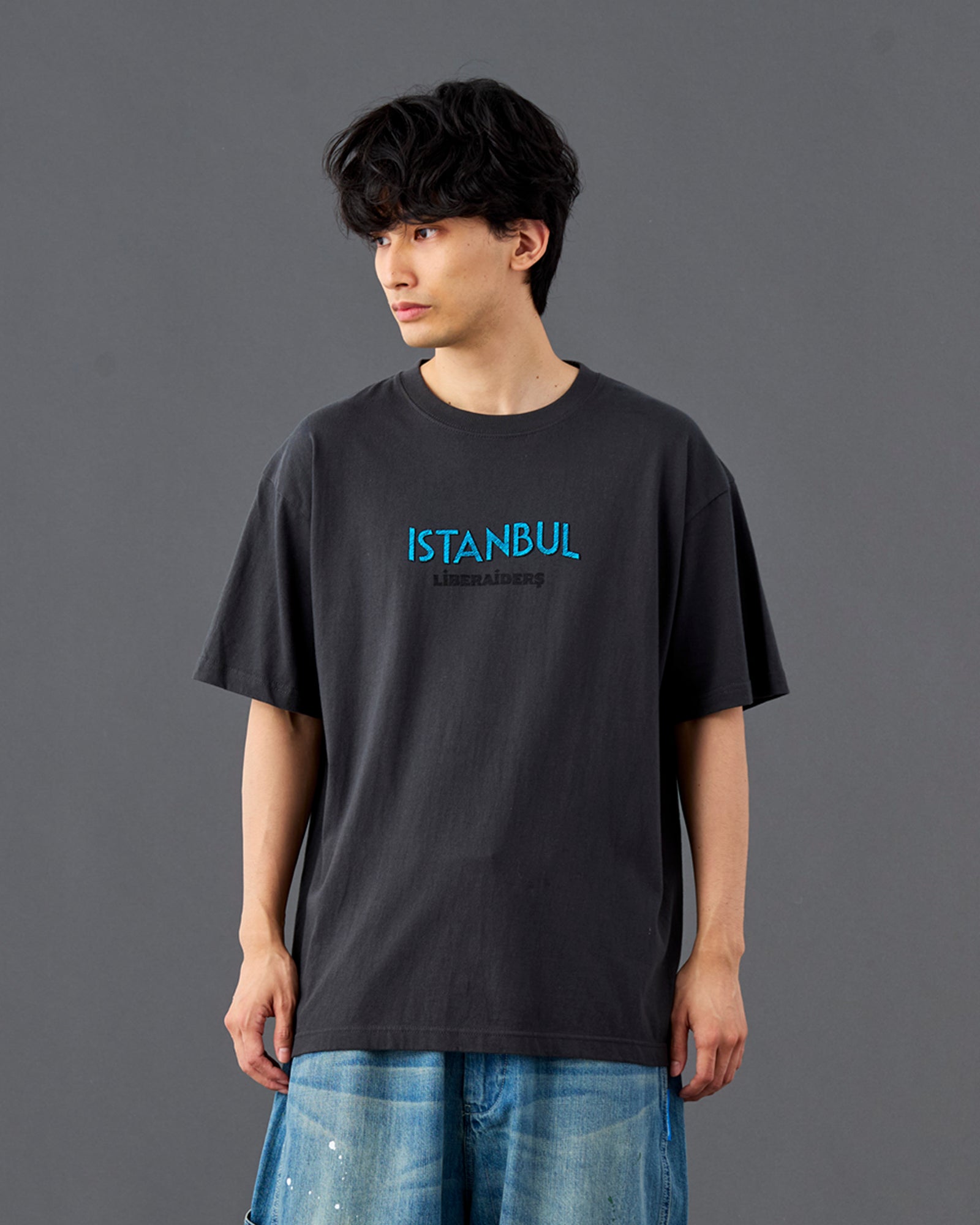 A Eckhaus Latta Shirt pictured on a model in front of a white background. The title of the product is Eckhaus Latta Eclipse Turtleneck - Stone and the image was taken by 199A®.