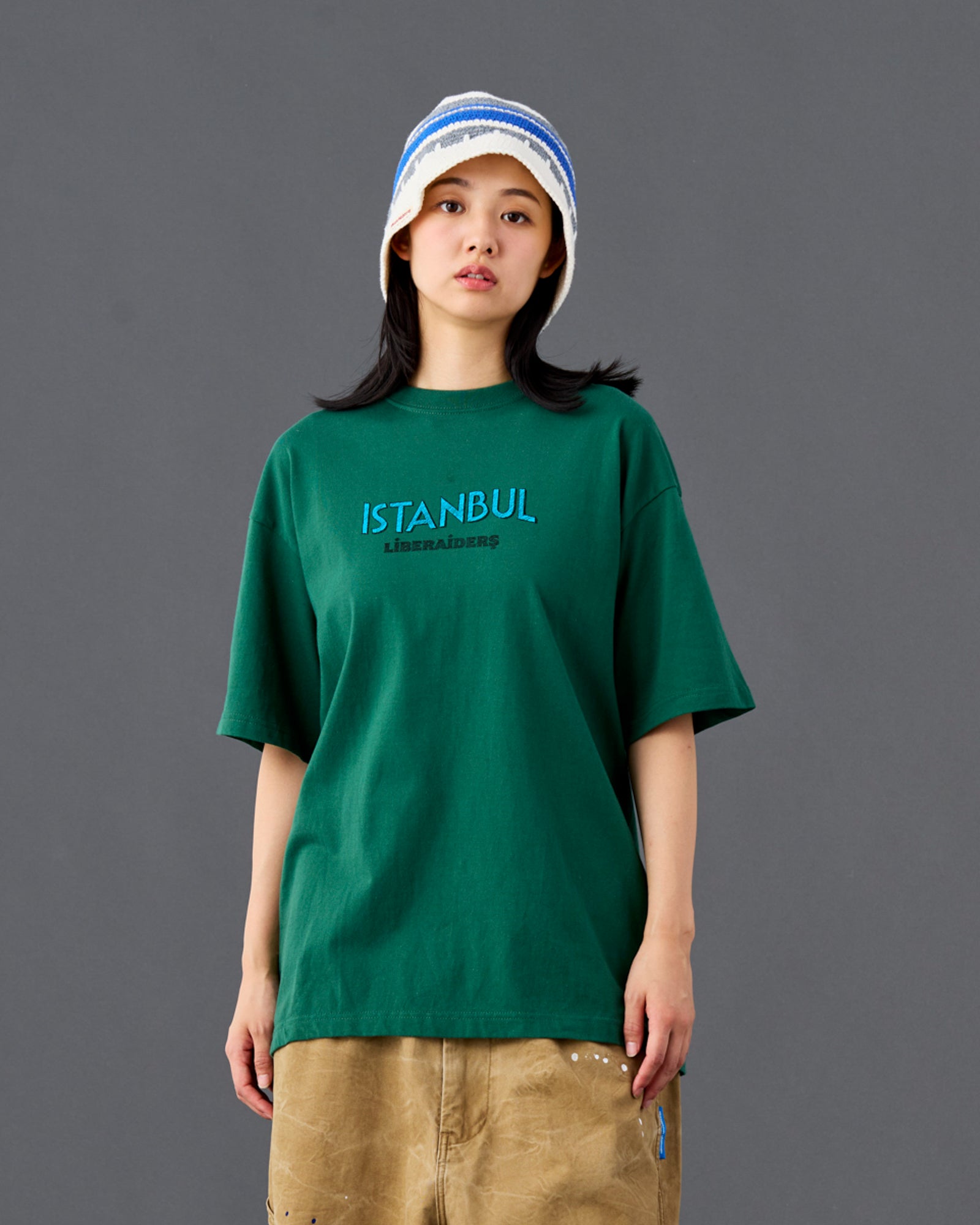 A Eckhaus Latta Shirt pictured on a model in front of a white background. The title of the product is Eckhaus Latta Eclipse Turtleneck - Stone and the image was taken by 199A®.