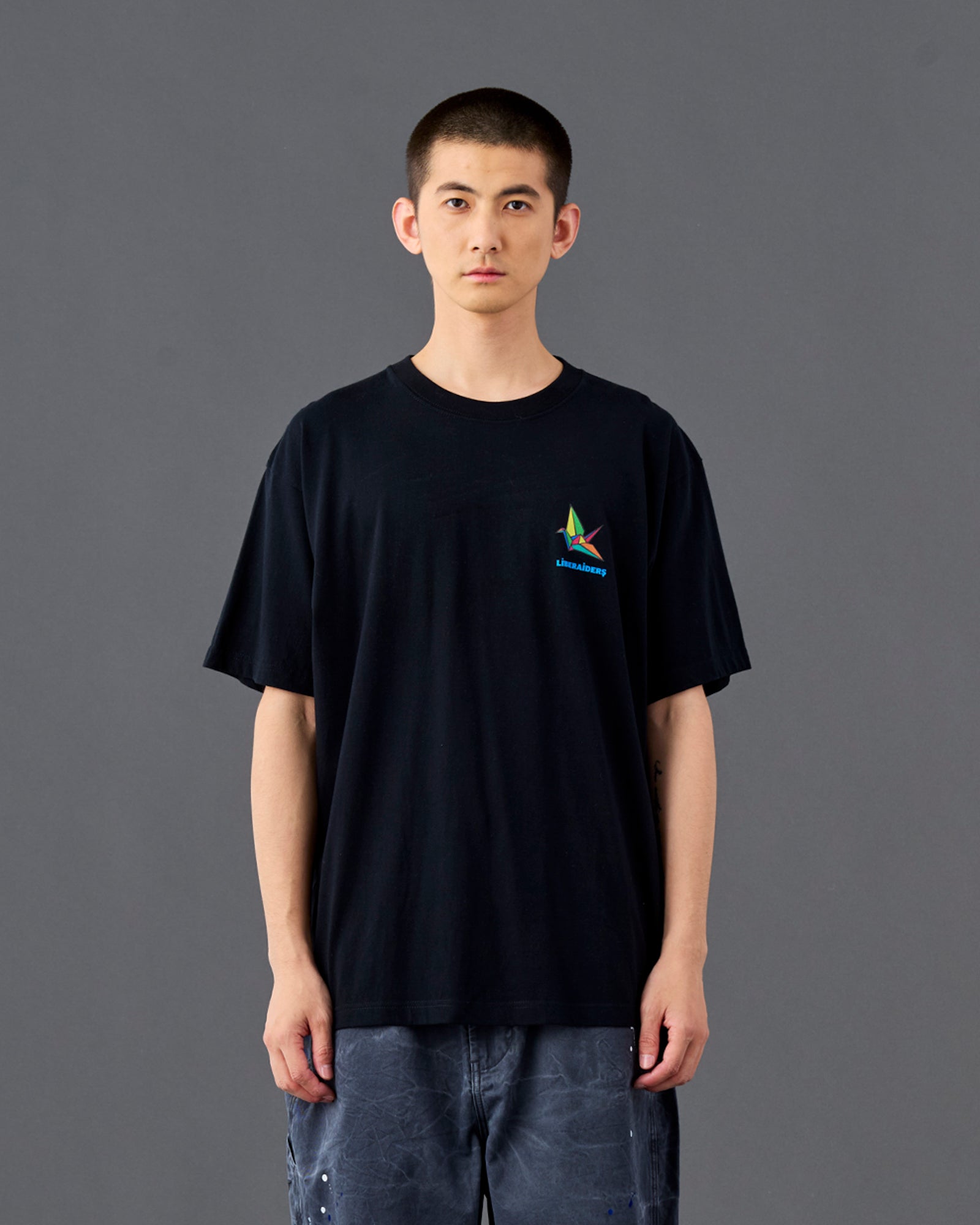 A Eckhaus Latta Shirt pictured on a model in front of a white background. The title of the product is Eckhaus Latta Eclipse Turtleneck - Stone and the image was taken by 199A®.