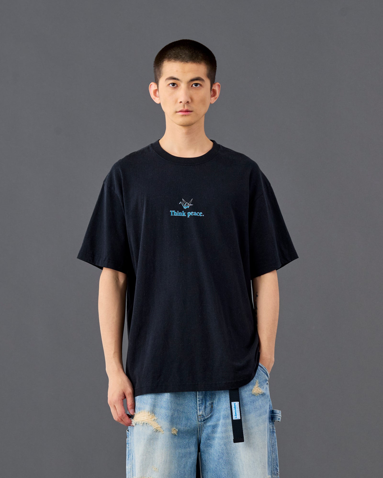 A Eckhaus Latta Shirt pictured on a model in front of a white background. The title of the product is Eckhaus Latta Eclipse Turtleneck - Stone and the image was taken by 199A®.