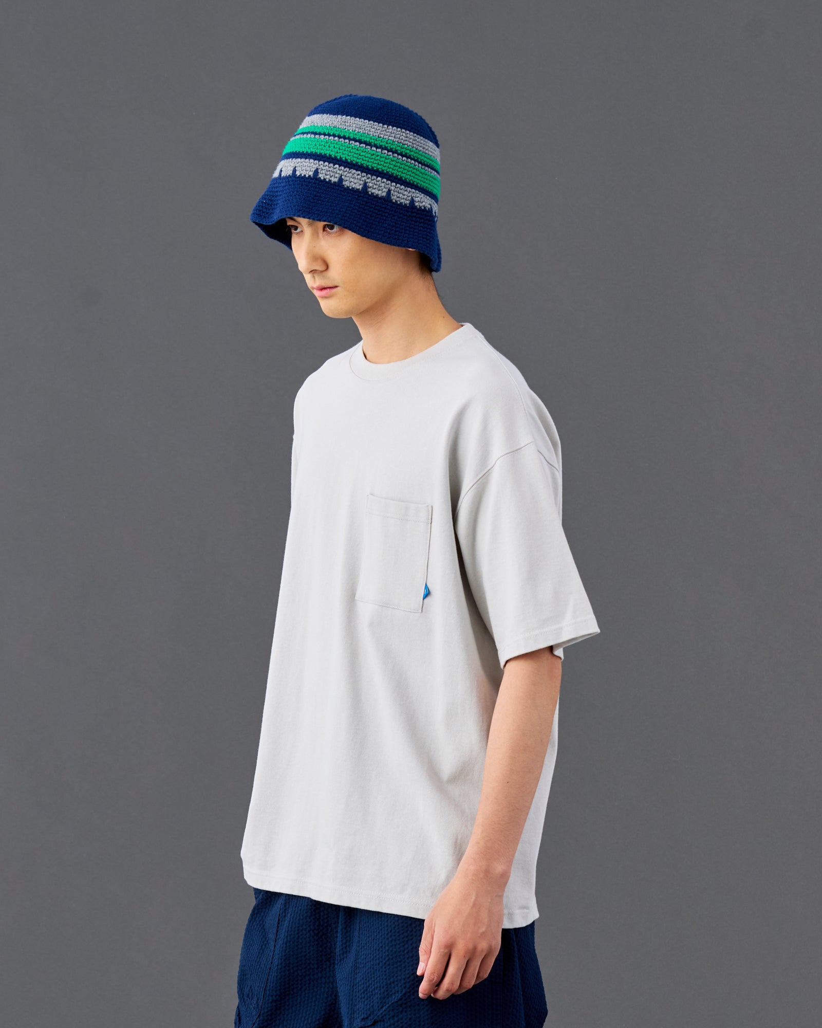 A Eckhaus Latta Shirt pictured on a model in front of a white background. The title of the product is Eckhaus Latta Eclipse Turtleneck - Stone and the image was taken by 199A®.