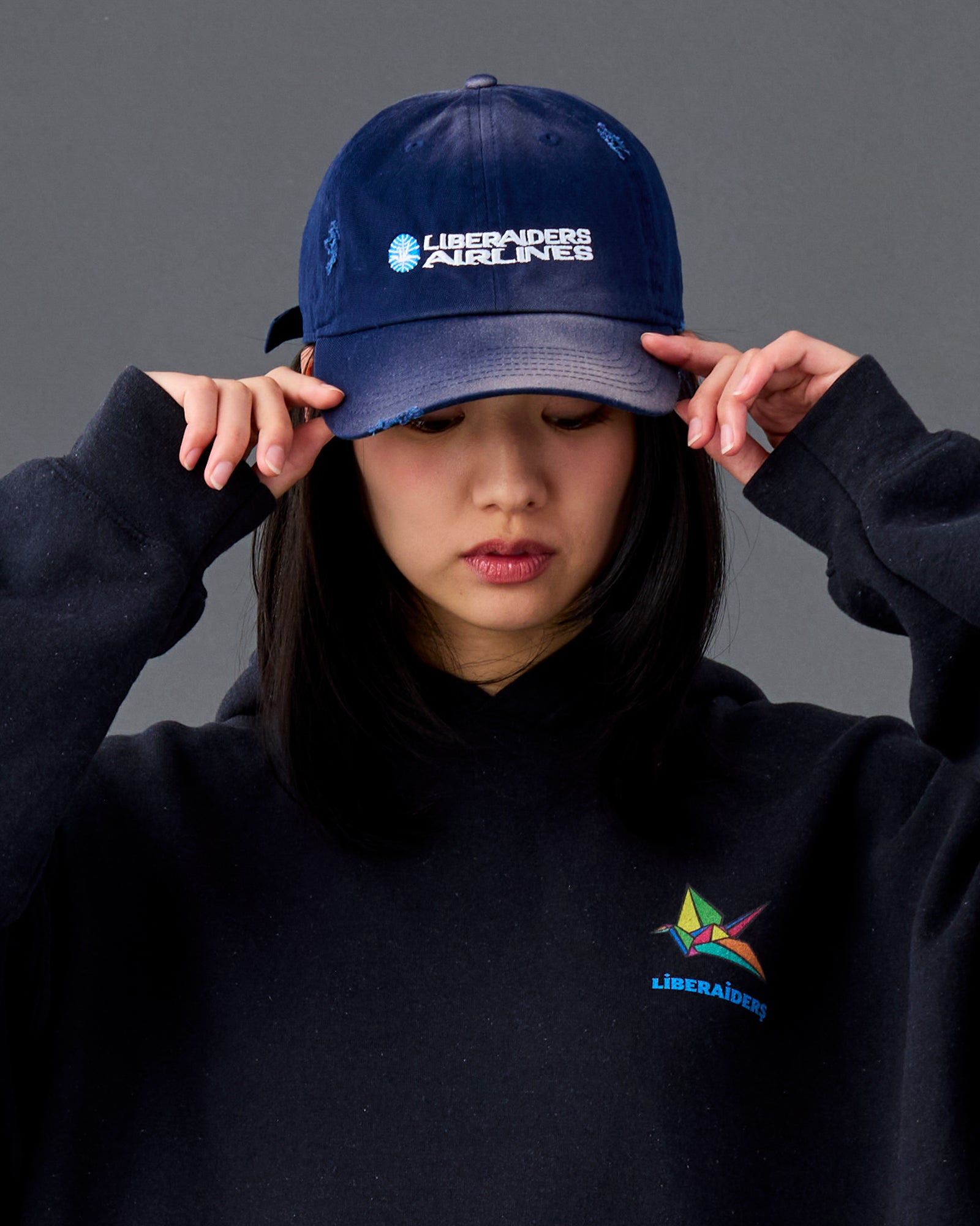 A Eckhaus Latta Shirt pictured on a model in front of a white background. The title of the product is Eckhaus Latta Eclipse Turtleneck - Stone and the image was taken by 199A®.