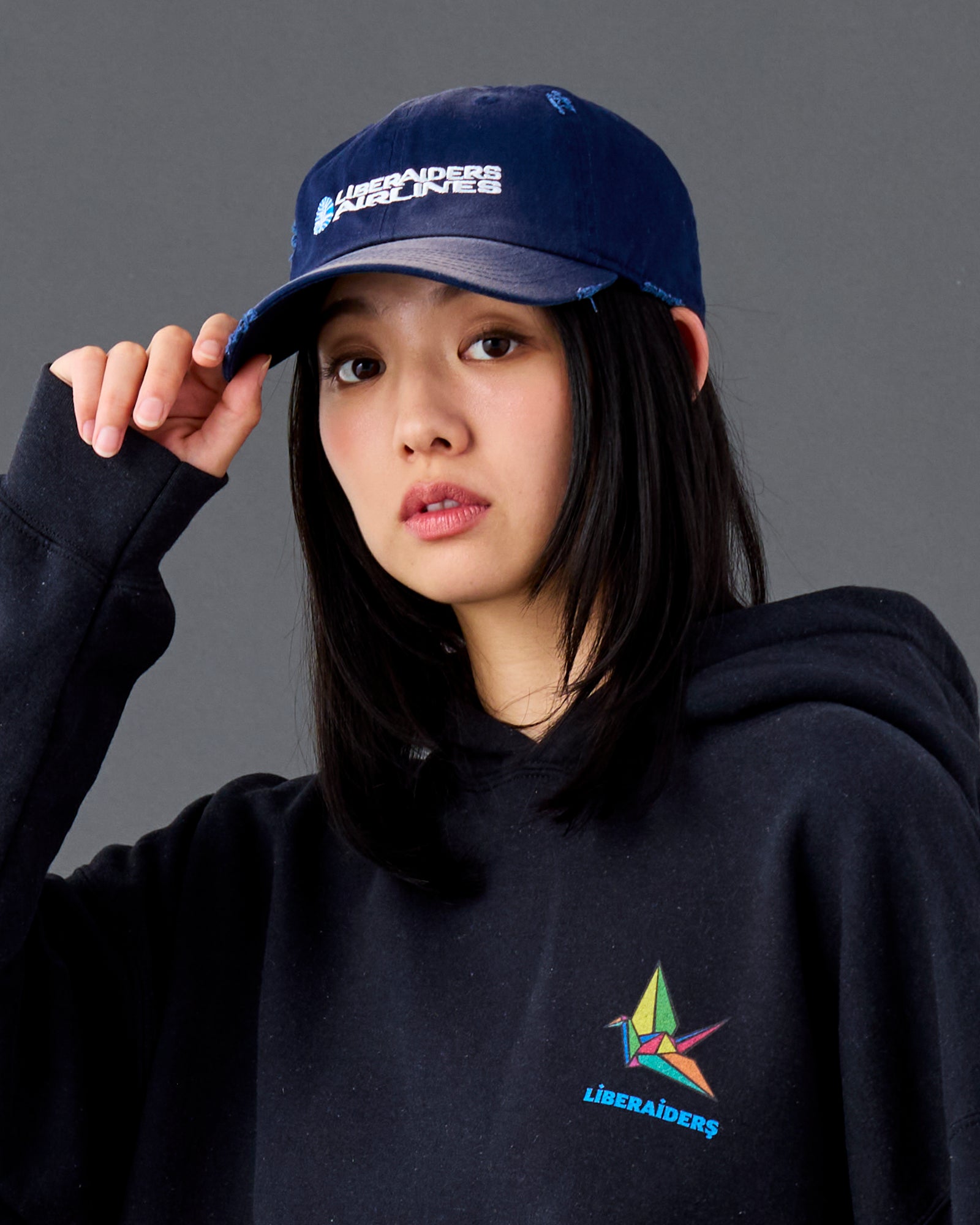 A Eckhaus Latta Shirt pictured on a model in front of a white background. The title of the product is Eckhaus Latta Eclipse Turtleneck - Stone and the image was taken by 199A®.