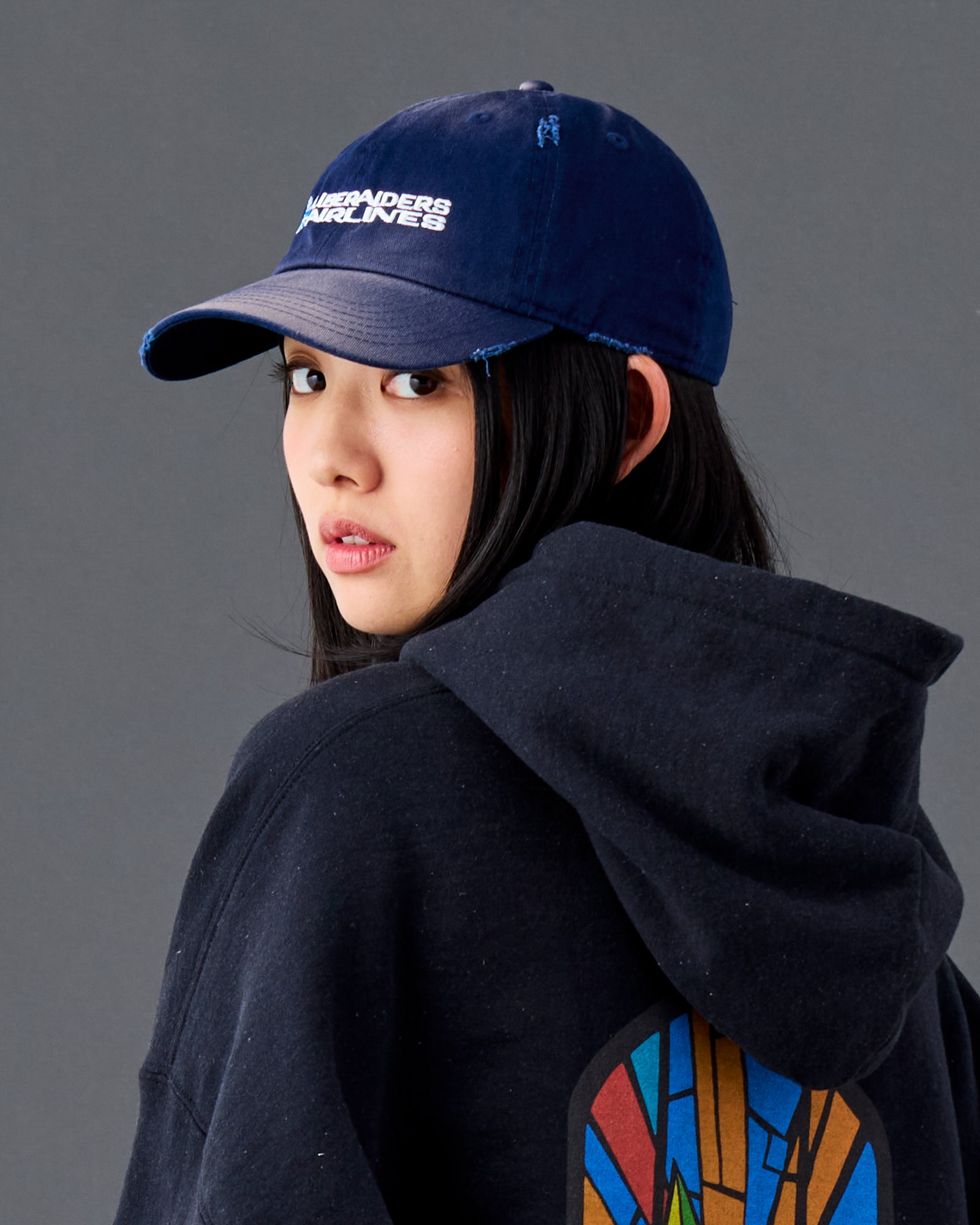 A Eckhaus Latta Shirt pictured on a model in front of a white background. The title of the product is Eckhaus Latta Eclipse Turtleneck - Stone and the image was taken by 199A®.