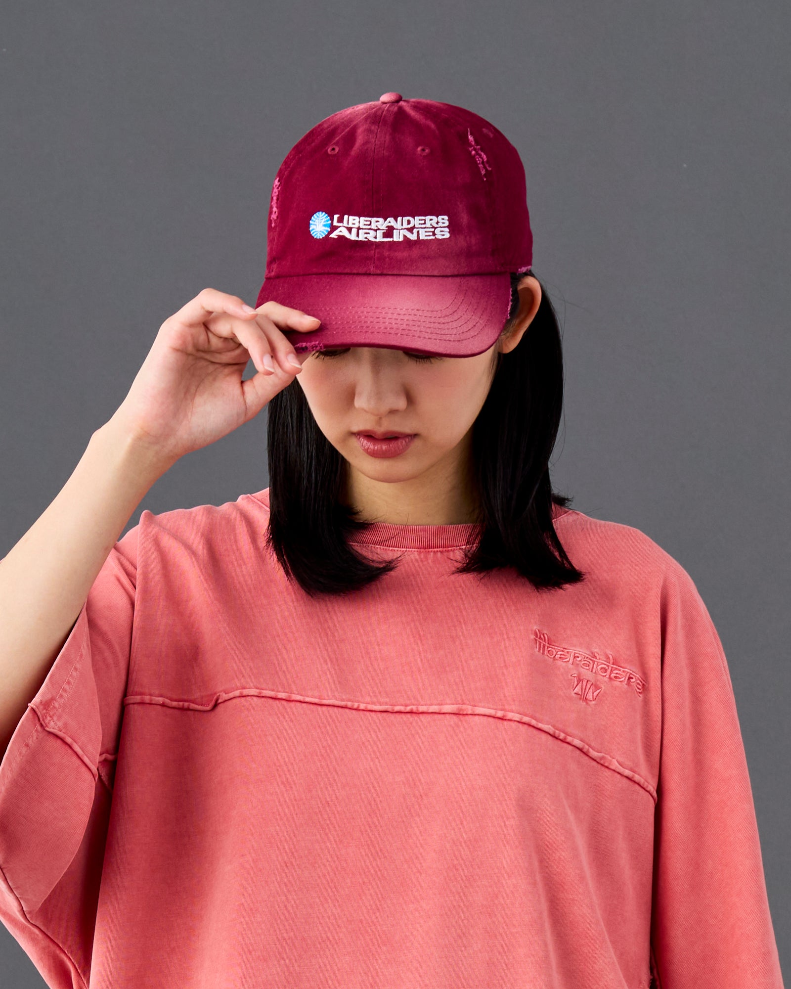 A Eckhaus Latta Shirt pictured on a model in front of a white background. The title of the product is Eckhaus Latta Eclipse Turtleneck - Stone and the image was taken by 199A®.