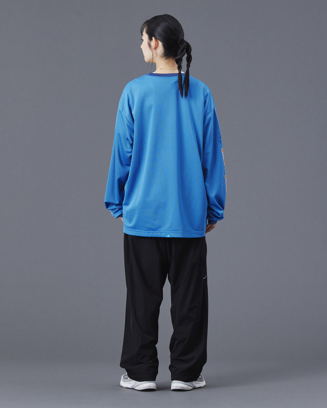 A Eckhaus Latta Shirt pictured on a model in front of a white background. The title of the product is Eckhaus Latta Eclipse Turtleneck - Stone and the image was taken by 199A®.
