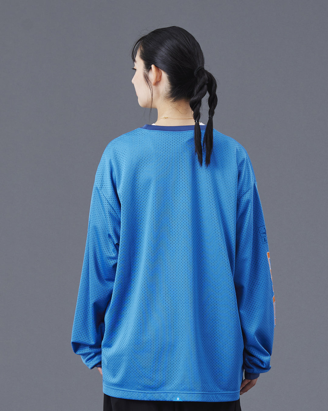 A Eckhaus Latta Shirt pictured on a model in front of a white background. The title of the product is Eckhaus Latta Eclipse Turtleneck - Stone and the image was taken by 199A®.