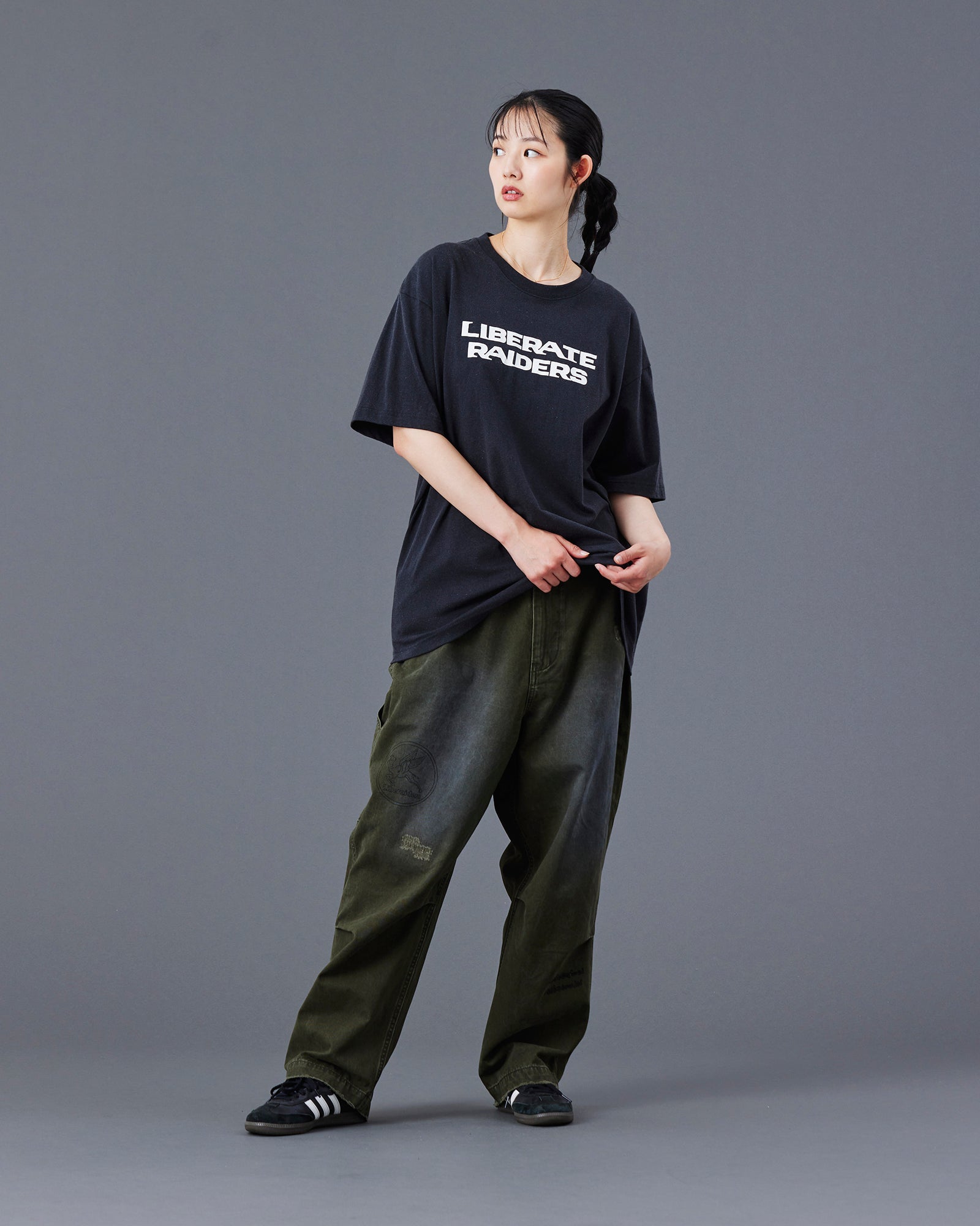 A Eckhaus Latta Shirt pictured on a model in front of a white background. The title of the product is Eckhaus Latta Eclipse Turtleneck - Stone and the image was taken by 199A®.