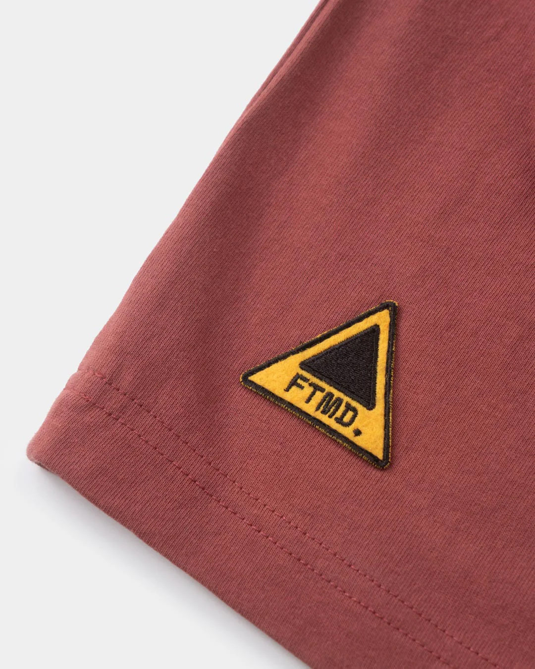 A Eckhaus Latta Shirt pictured on a model in front of a white background. The title of the product is Eckhaus Latta Eclipse Turtleneck - Stone and the image was taken by 199A®.