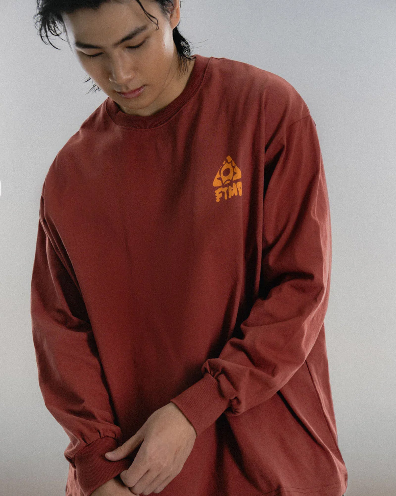 A Eckhaus Latta Shirt pictured on a model in front of a white background. The title of the product is Eckhaus Latta Eclipse Turtleneck - Stone and the image was taken by 199A®.