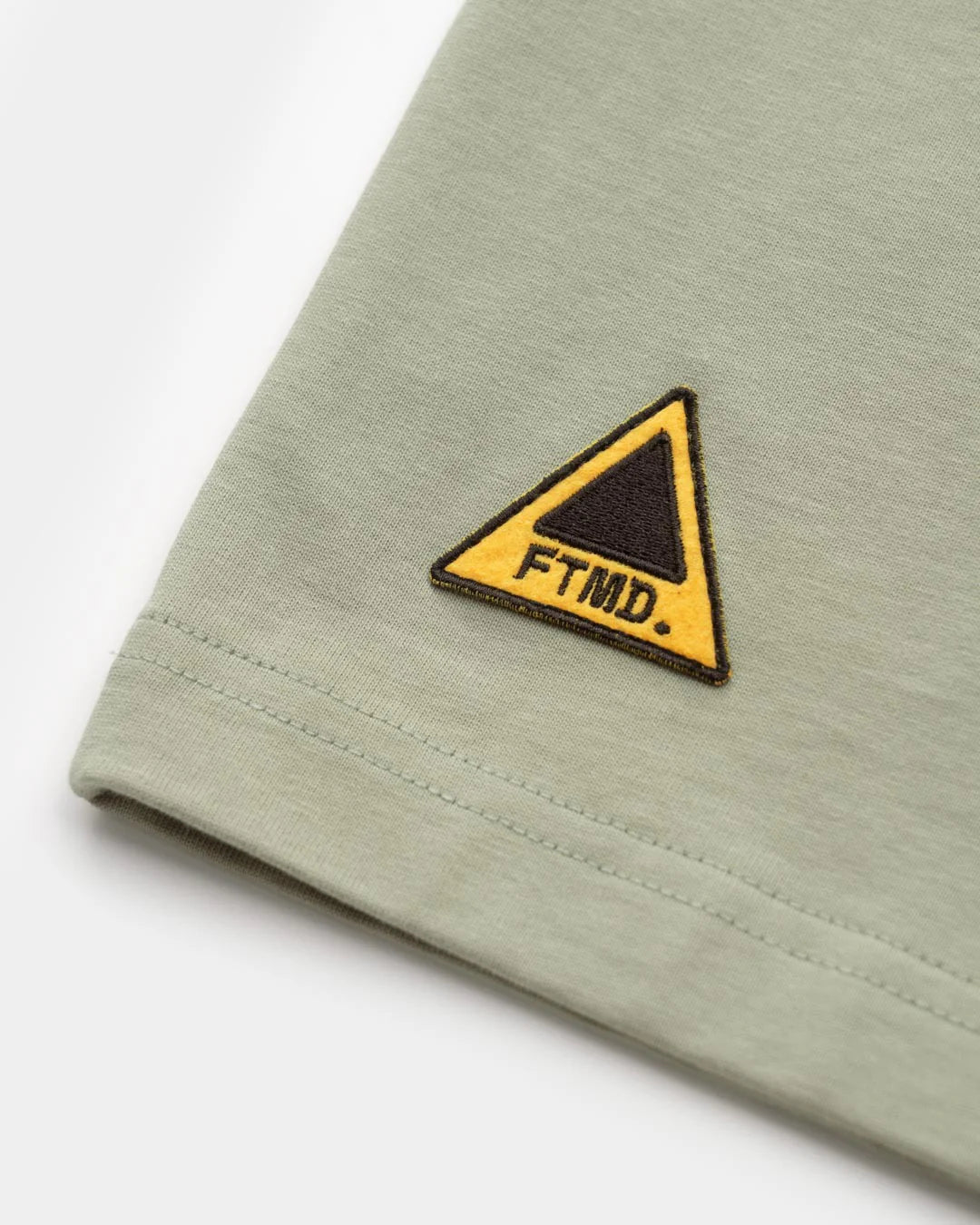 A Eckhaus Latta Shirt pictured on a model in front of a white background. The title of the product is Eckhaus Latta Eclipse Turtleneck - Stone and the image was taken by 199A®.