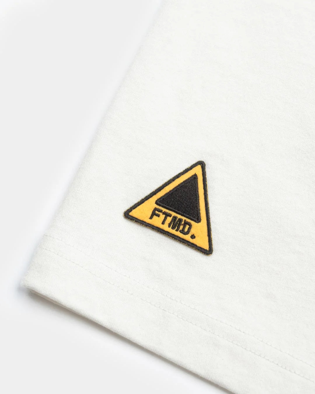 A Eckhaus Latta Shirt pictured on a model in front of a white background. The title of the product is Eckhaus Latta Eclipse Turtleneck - Stone and the image was taken by 199A®.