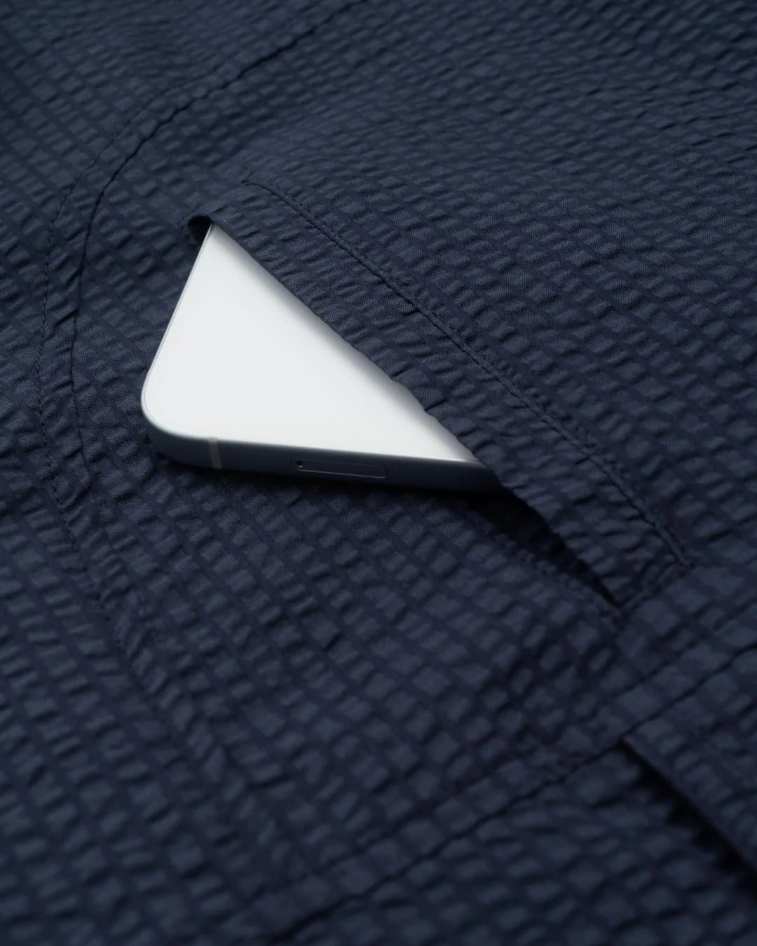 A Eckhaus Latta Shirt pictured on a model in front of a white background. The title of the product is Eckhaus Latta Eclipse Turtleneck - Stone and the image was taken by 199A®.