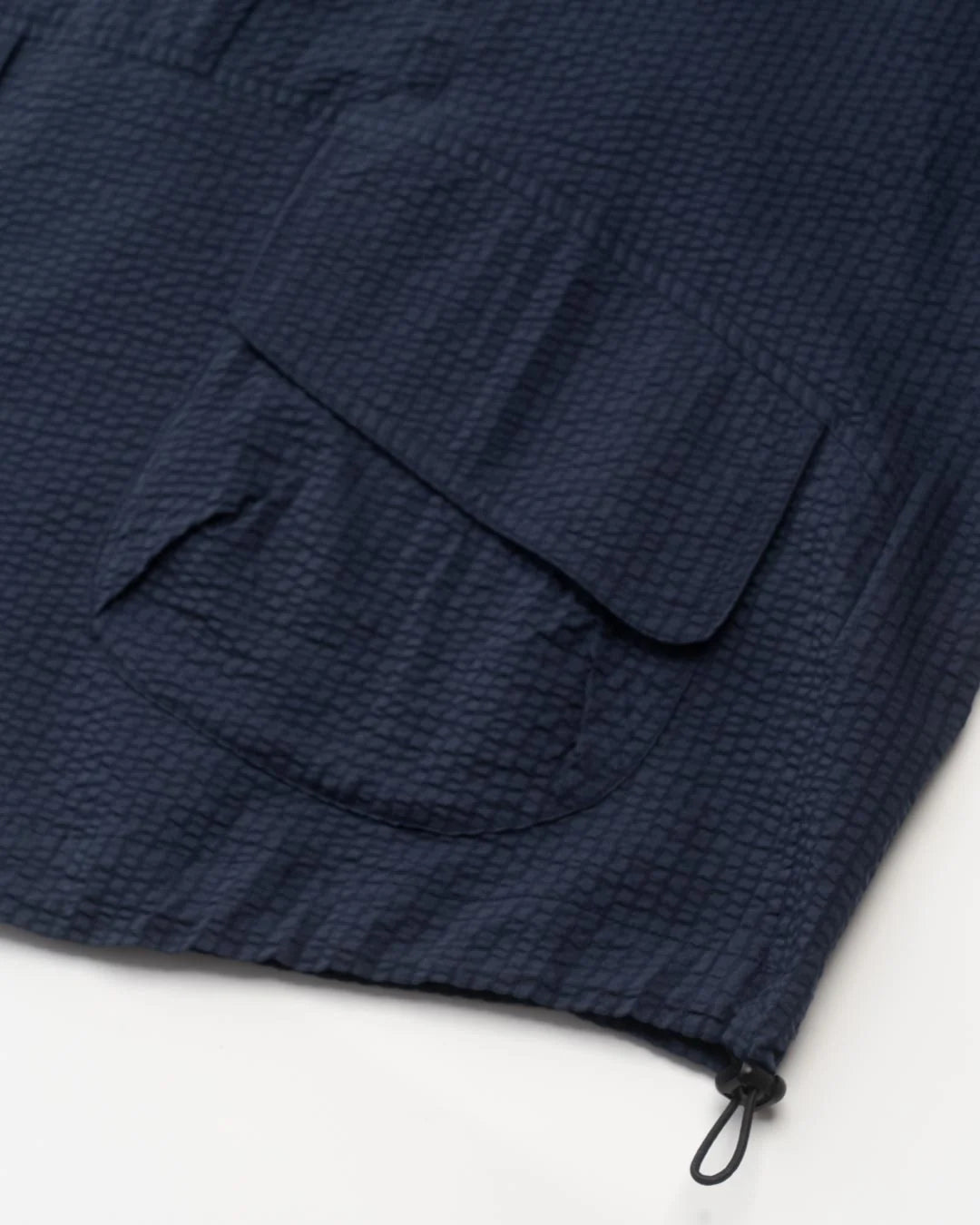A Eckhaus Latta Shirt pictured on a model in front of a white background. The title of the product is Eckhaus Latta Eclipse Turtleneck - Stone and the image was taken by 199A®.