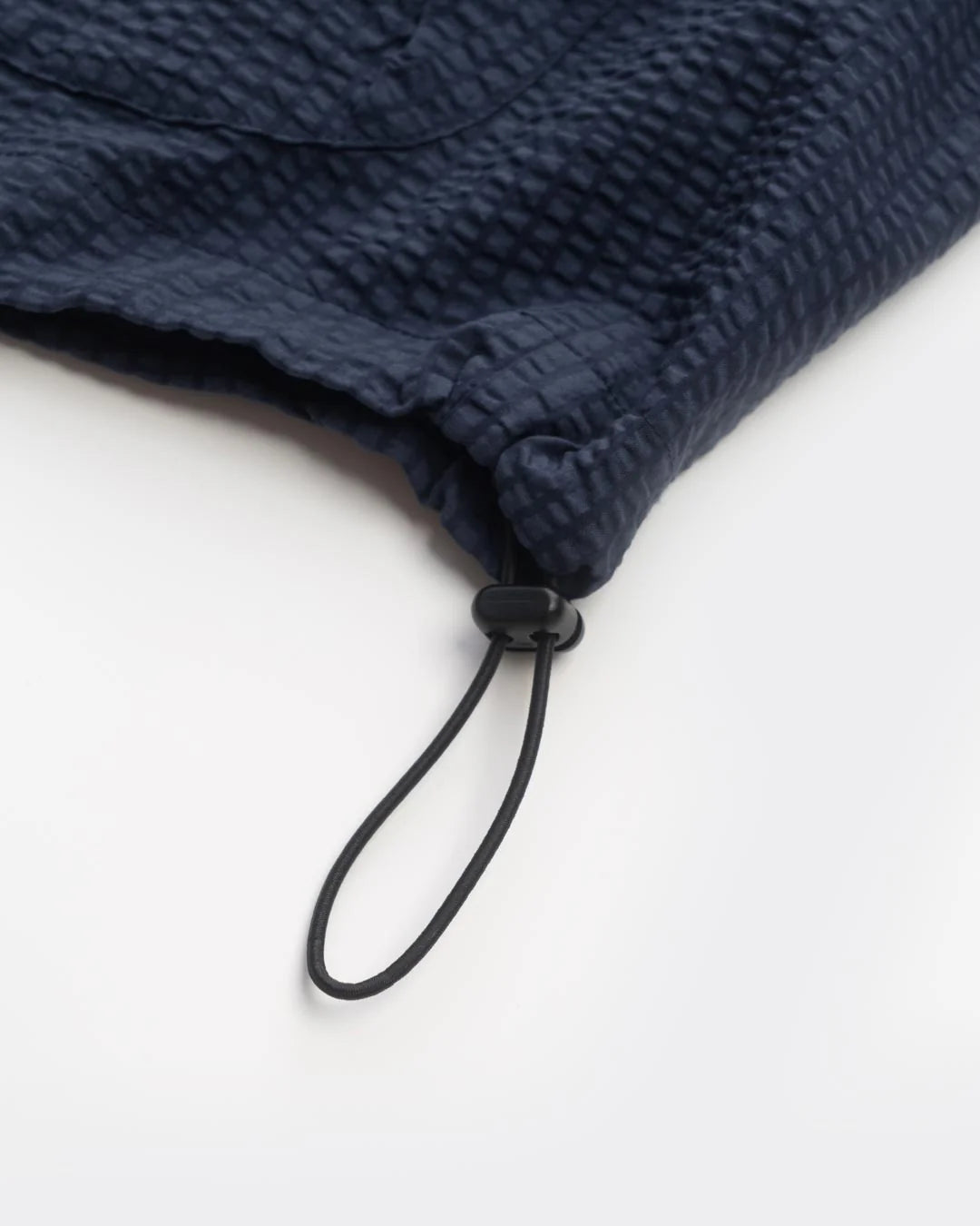 A Eckhaus Latta Shirt pictured on a model in front of a white background. The title of the product is Eckhaus Latta Eclipse Turtleneck - Stone and the image was taken by 199A®.
