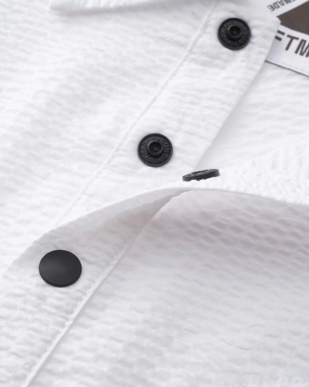 A Eckhaus Latta Shirt pictured on a model in front of a white background. The title of the product is Eckhaus Latta Eclipse Turtleneck - Stone and the image was taken by 199A®.