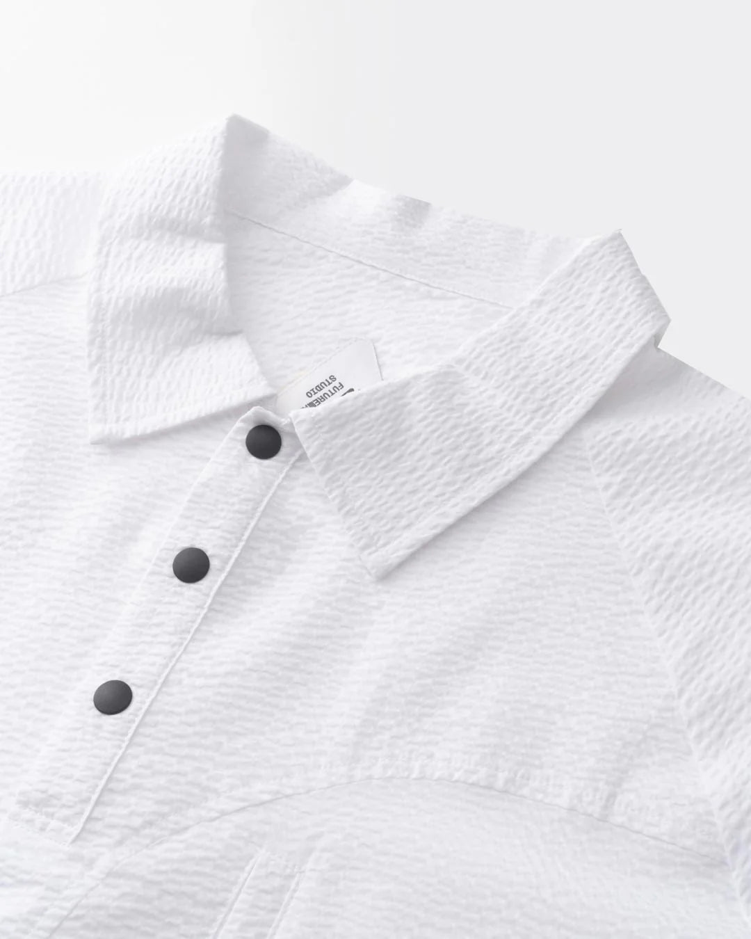 A Eckhaus Latta Shirt pictured on a model in front of a white background. The title of the product is Eckhaus Latta Eclipse Turtleneck - Stone and the image was taken by 199A®.