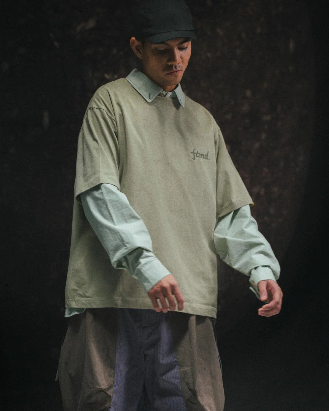 A Eckhaus Latta Shirt pictured on a model in front of a white background. The title of the product is Eckhaus Latta Eclipse Turtleneck - Stone and the image was taken by 199A®.