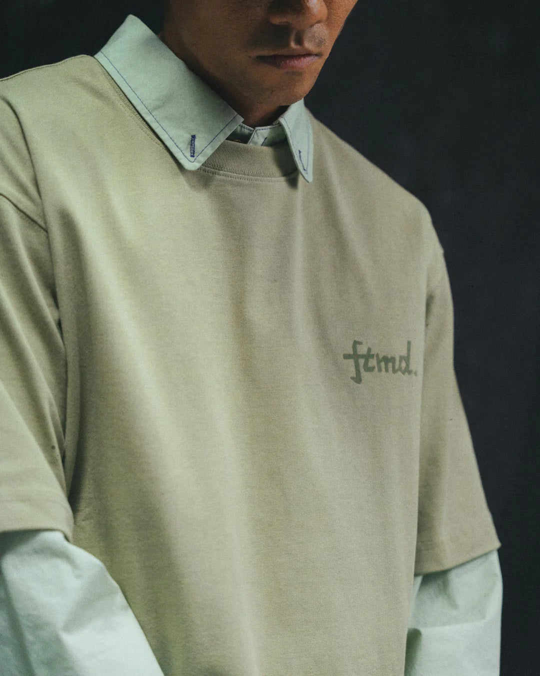 A Eckhaus Latta Shirt pictured on a model in front of a white background. The title of the product is Eckhaus Latta Eclipse Turtleneck - Stone and the image was taken by 199A®.