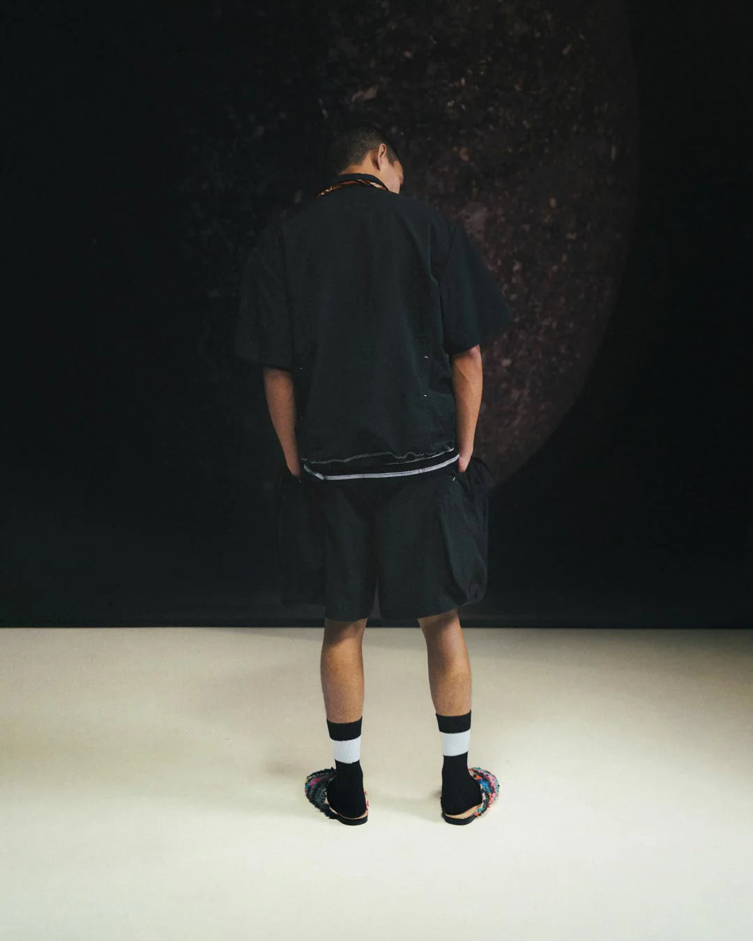 A Eckhaus Latta Shirt pictured on a model in front of a white background. The title of the product is Eckhaus Latta Eclipse Turtleneck - Stone and the image was taken by 199A®.