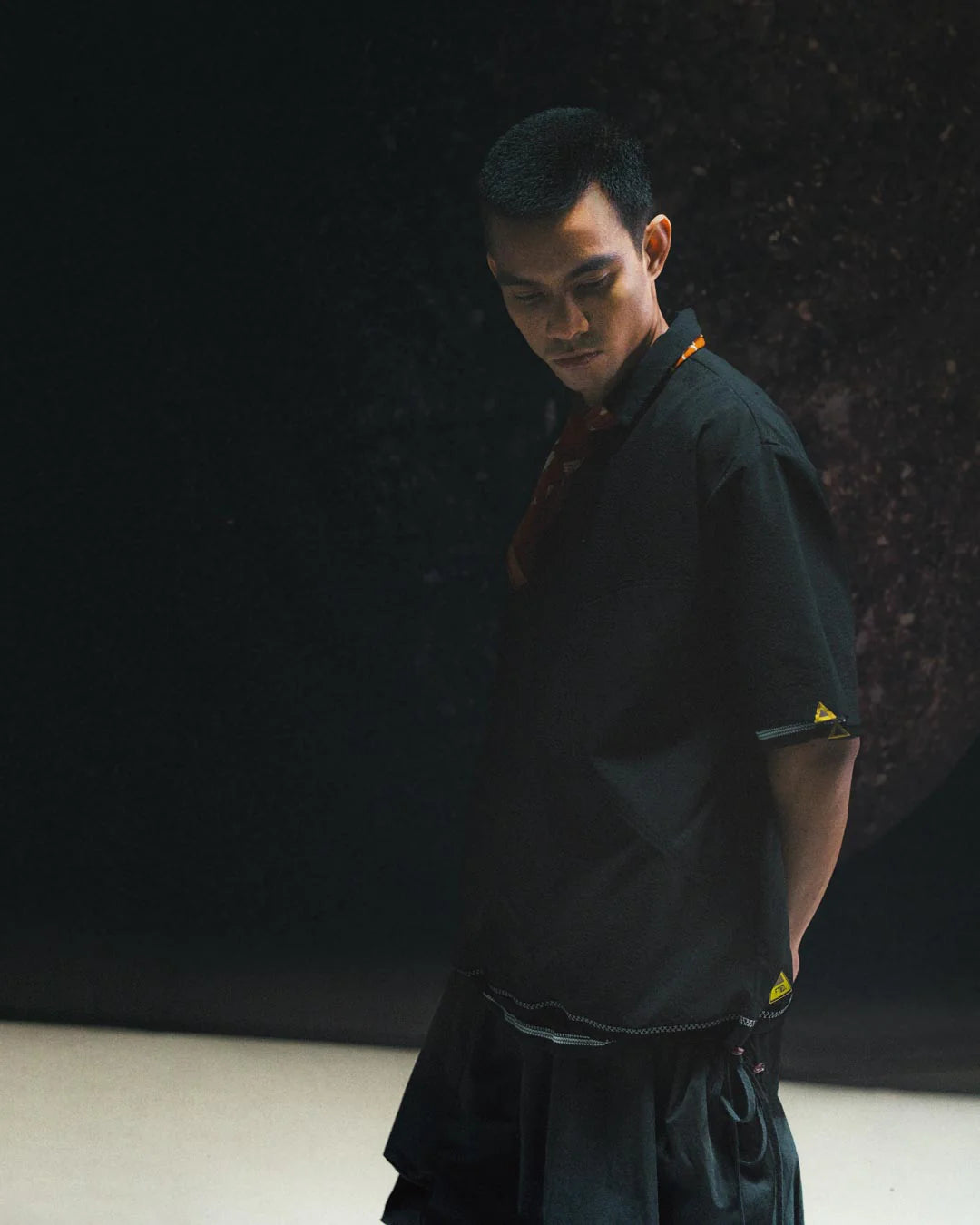 A Eckhaus Latta Shirt pictured on a model in front of a white background. The title of the product is Eckhaus Latta Eclipse Turtleneck - Stone and the image was taken by 199A®.