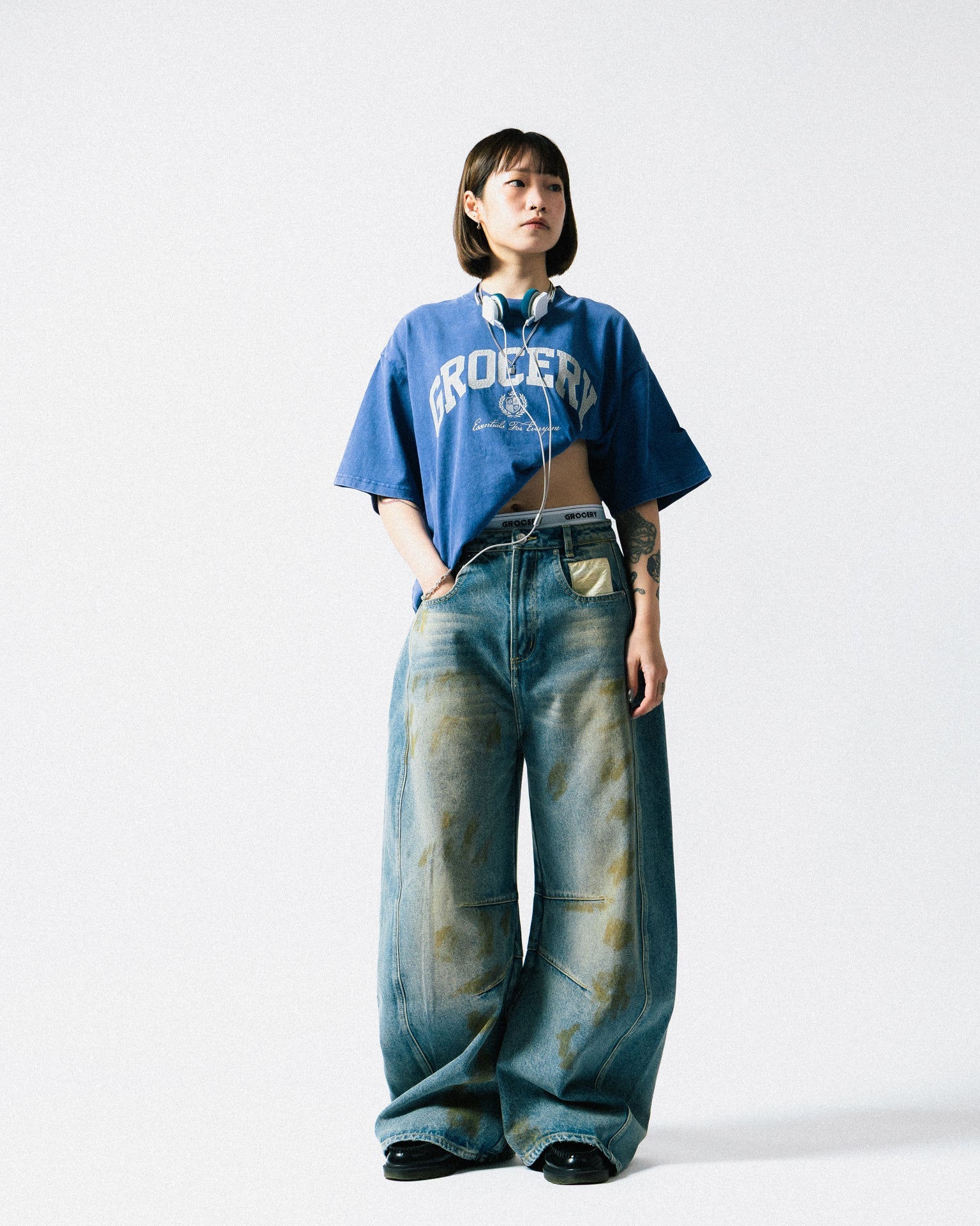 A Eckhaus Latta Shirt pictured on a model in front of a white background. The title of the product is Eckhaus Latta Eclipse Turtleneck - Stone and the image was taken by 199A®.